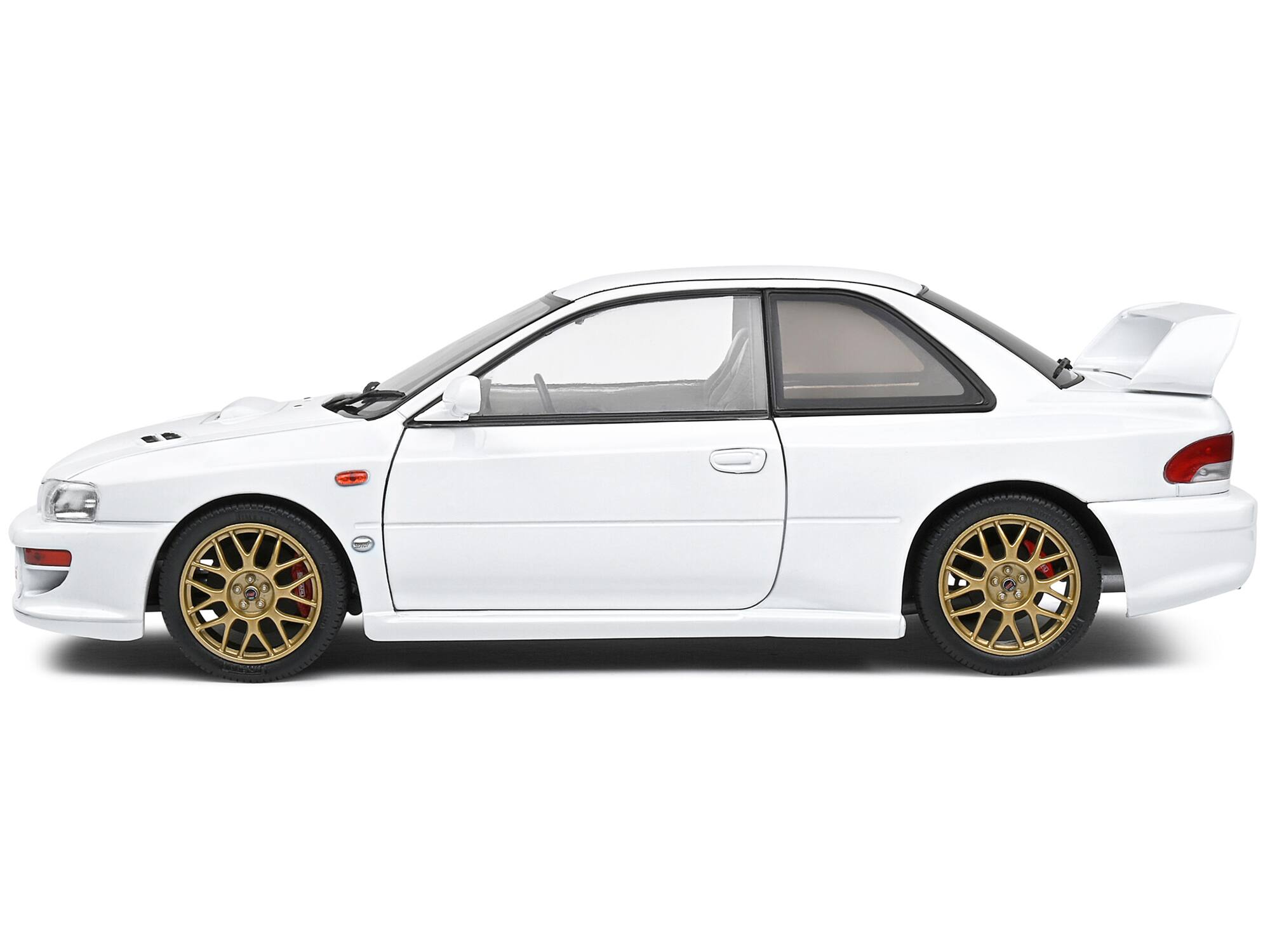 Left. Solido - 1998 Subaru Impreza 22B RHD (Right Hand Drive) Pure White with Gold Wheels 1/18 Diecast Model Car by Solido - Pure White With Gold.