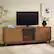 Angle. Walker Edison - Reema 70" Modern Reeded TV Stand with Freestanding Electric Fireplace - English Oak.