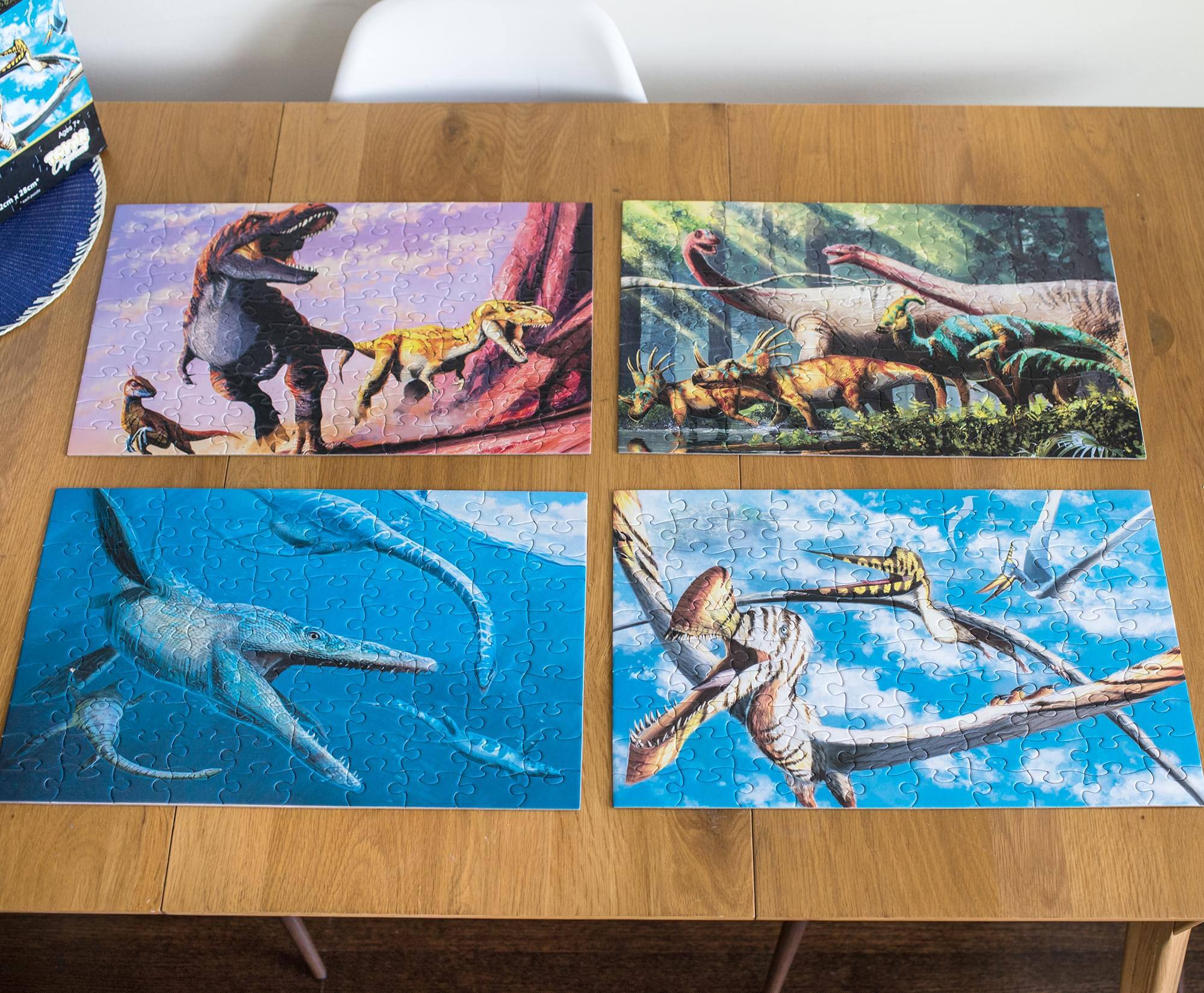 Alt View 4. Toynk - Dinosaur 100-Piece Jigsaw Puzzle Box Bundle | Set of 4 - Multi-Color.