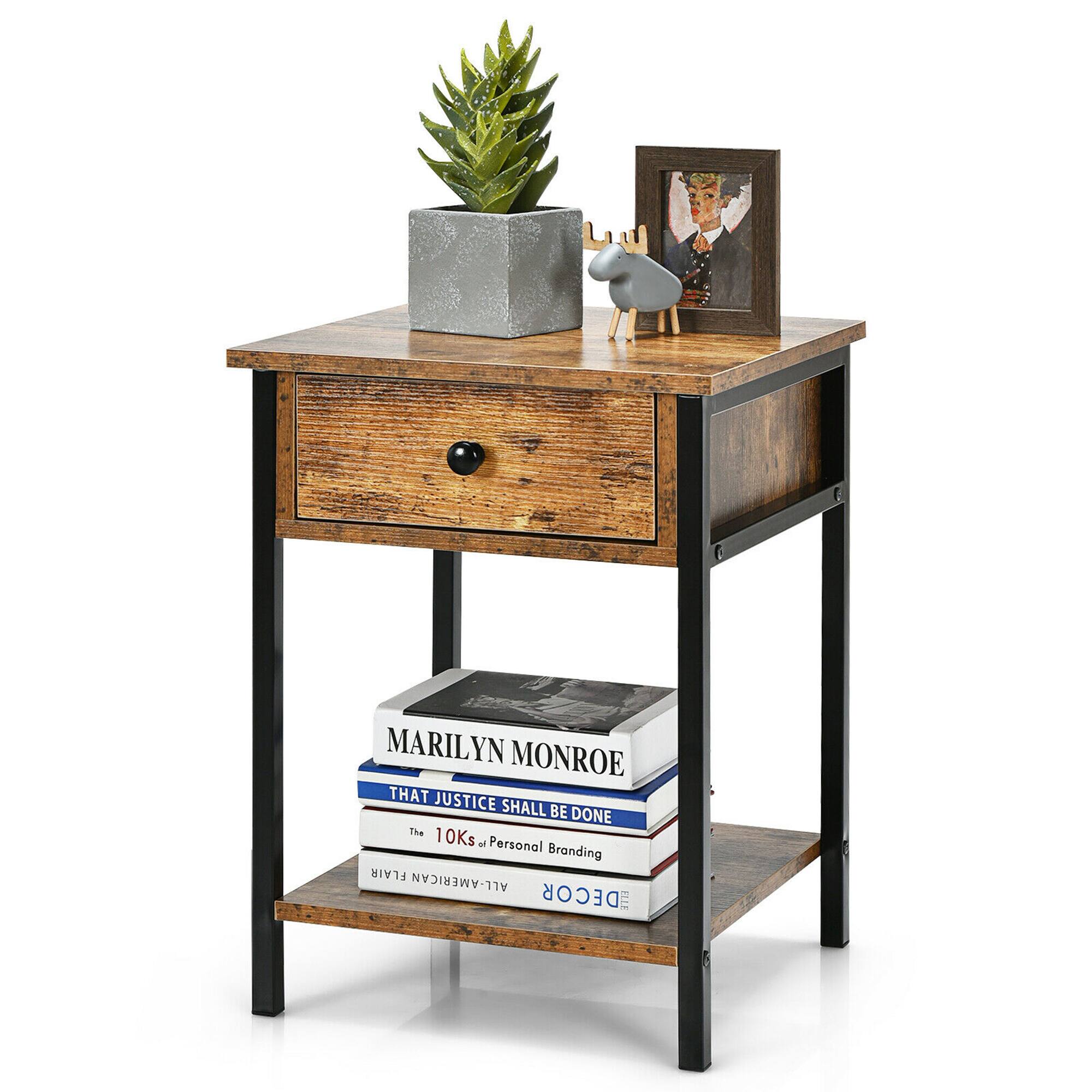 The image features a wooden table with a variety of items on it. There is a plant in a pot, a book, and a picture frame. Additionally, there is a vase and a small statue on the table. The table is also adorned with a Marilyn Monroe book, which is placed on top of the table.