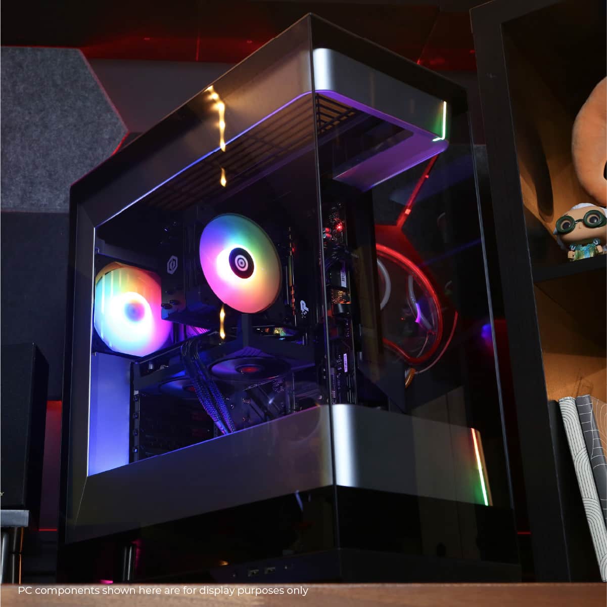 The image displays a computer case with a rainbow light inside, which is a PC component. The components shown here are for display purposes only, and not for any practical use.