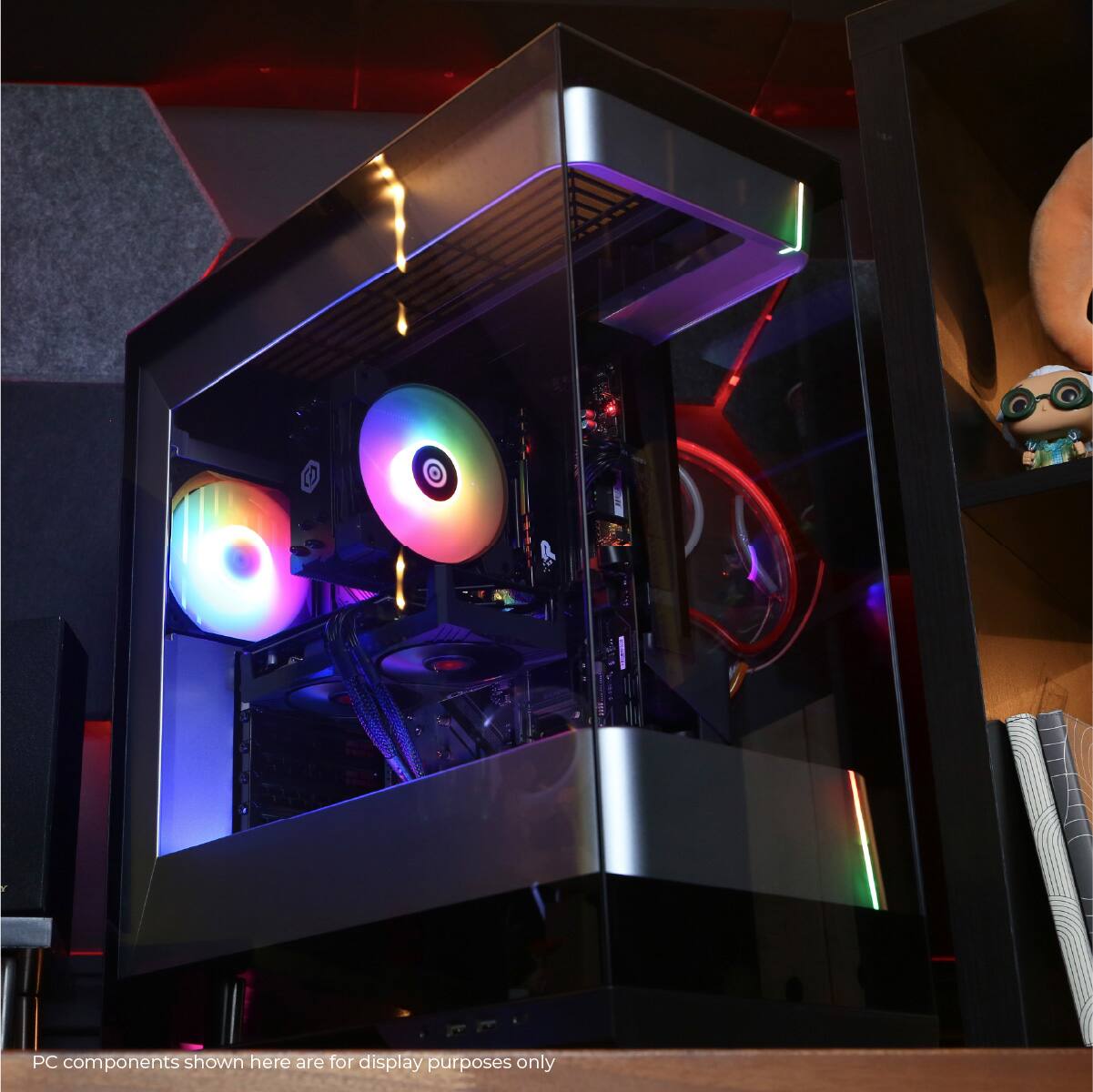 The image displays a computer case with a rainbow light inside, which is a PC component. The components shown here are for display purposes only, and not for any practical use.