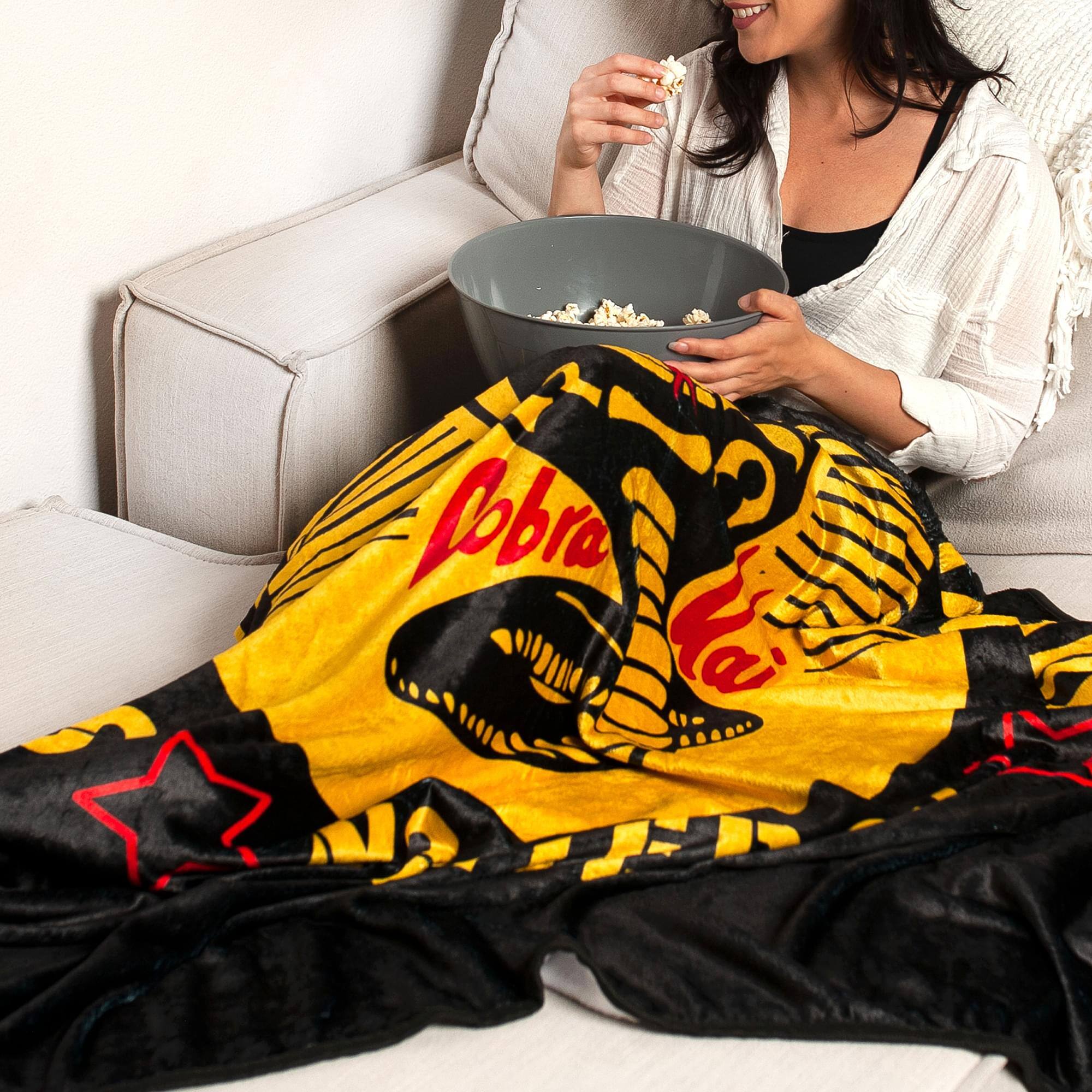 Alt View 2. Surreal Entertainment - Cobra Kai "Strike First" Fleece Throw Blanket | 45 x 60 Inches - Yellow.