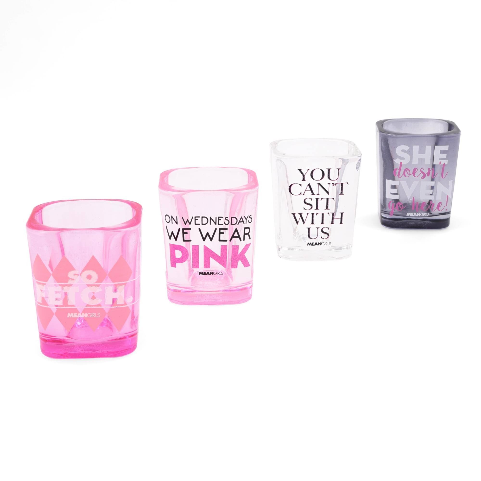Sure, here is the corrected and grouped text from the image:

1. **Pink Glass:**
   - "ON WEDNESDAYS WE WEAR PINK"
   - "MEAN GIRLS"

2. **Clear Glass:**
   - "YOU CAN'T SIT WITH US"
   - "MEAN GIRLS"

3. **Gray Glass:**
   - "SHE doesn't EVEN go here!"
   - "MEAN GIRLS"

4. **Pink Glass (Background):**
   - "SO FETCH."
   - "MEAN GIRLS"