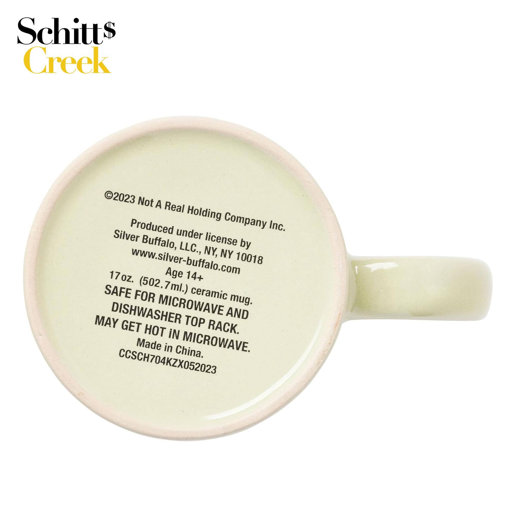Schitts Creek

©2023 Not A Real Holding Company Inc.  
Produced under license by Silver Buffalo, LLC., NY, NY 10018  
www.silver-buffalo.com  
Age 14+  
17 oz. (502.7ml.) ceramic mug.  
SAFE FOR MICROWAVE AND DISHWASHER TOP RACK. MAY GET HOT IN MICROWAVE.  
Made in China.  
CCSCH704KZX052023