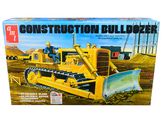 Sure, here is the corrected and grouped text from the image:
---
**a m t**
**CONSTRUCTION BULLDOZER**
Modèle réduit pour assembler
Un-assembled hobby kit
- ADJUSTABLE BLADE
- ADJUSTABLE RIPPER
- ATTACHMENT
- MOVABLE TRACKS
SPECIAL FEATURES ATTACHMENT
PROLACRE MOVABLE TRACKS
COLORS
---
This text is taken from the packaging of the construction bulldozer model kit.