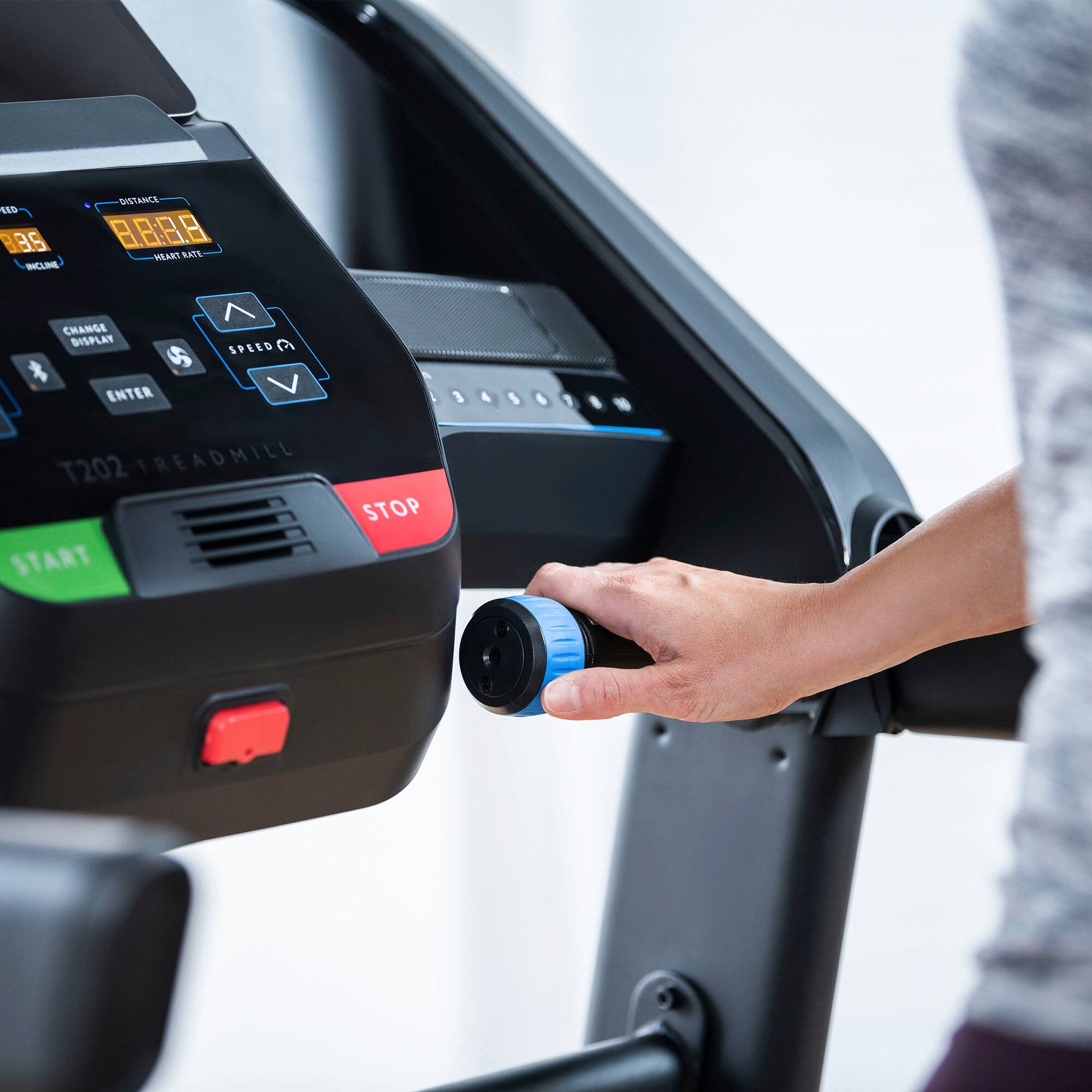 Sure, here is the corrected and grouped text from the image:

- **T202 TREADMILL**
- **DISTANCE** 8.808
- **HEART RATE**
- **SPEED** (with up and down arrows)
- **CHANGE DISPLAY**
- **ENTER**
- **START** (green button)
- **STOP** (red button)
- **INCLINE** 3.5
- **CHANGE DISPLAY** (with a dollar sign symbol)