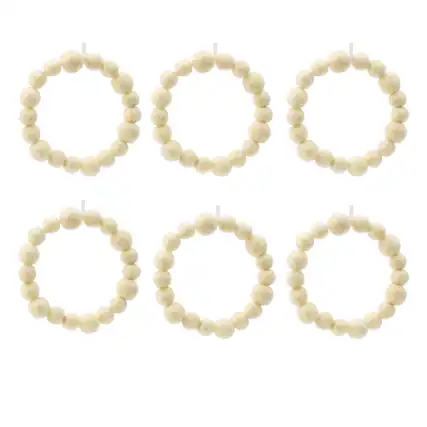 The image does not contain any text to group or correct. It shows several bracelets made of white beads.