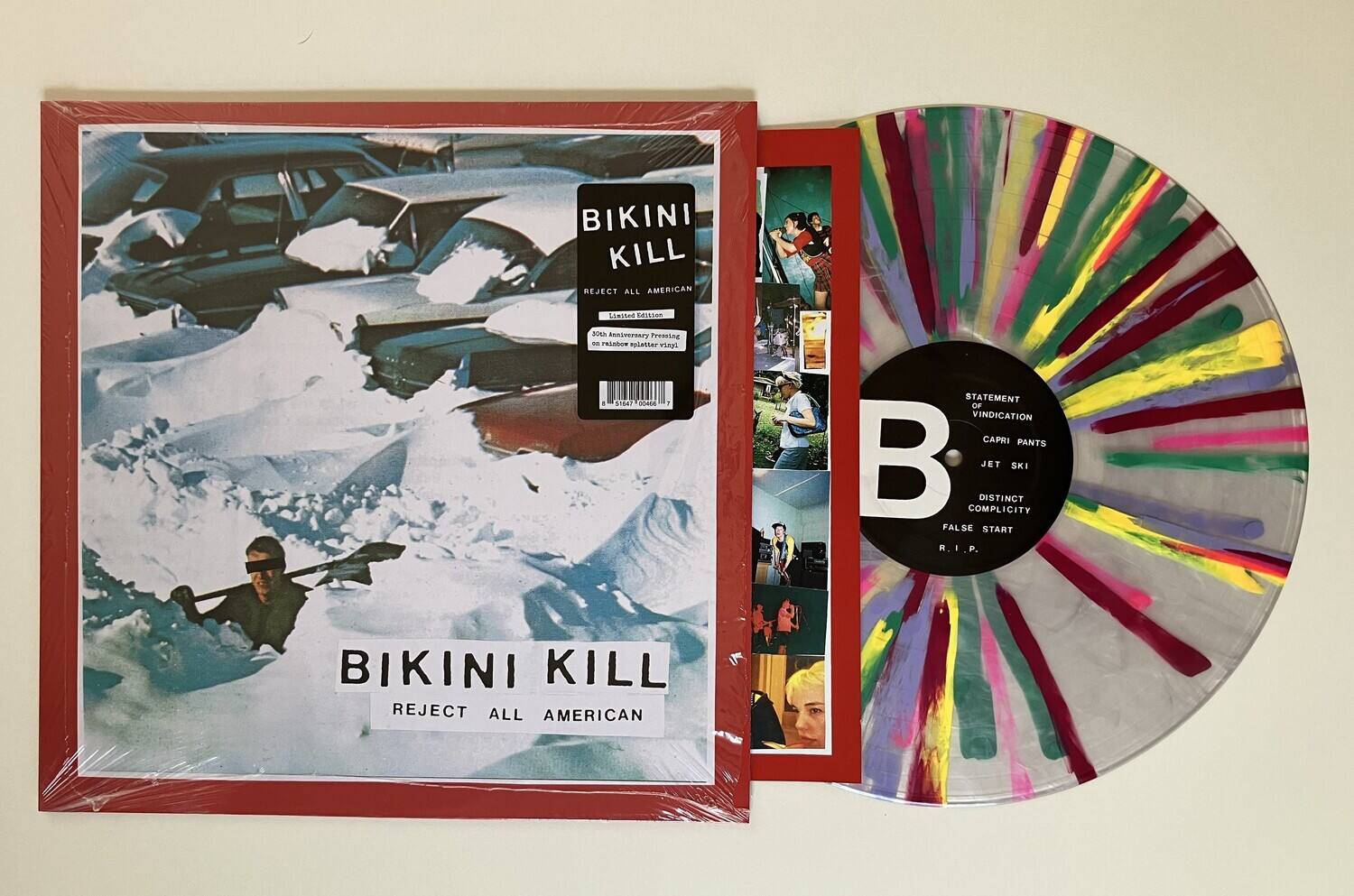BIKINI KILL  
REJECT ALL AMERICAN  

Lisites SWIN  
2018 40th Anniversary Pressing on rainbow splatter vinyl  

STATEMENT OF VINDICATION  
CAPRI PANTS  
DISTINCT COMPLICITY  
JET SKI  
FALSE START  
R. I. P.
