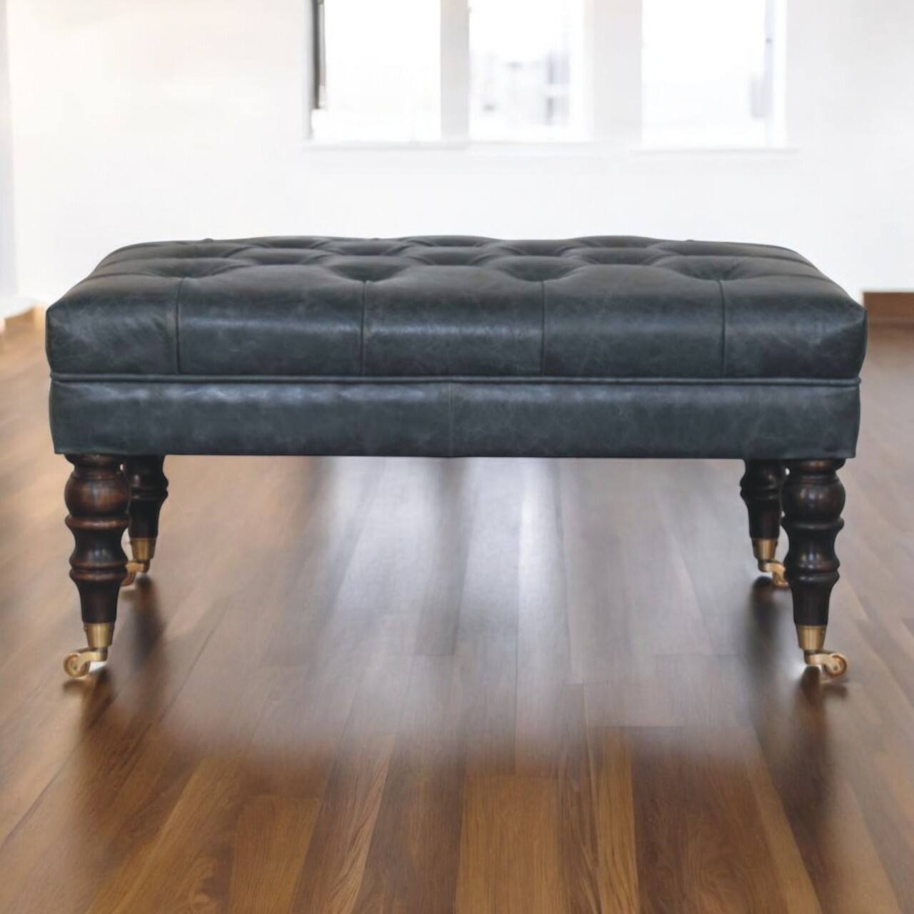 Angle. Artisan Furniture - Artisan Furniture Solid Wood Buffalo Teal Leather Ottoman with Castor Legs, Upholstered, Black Color - Black.