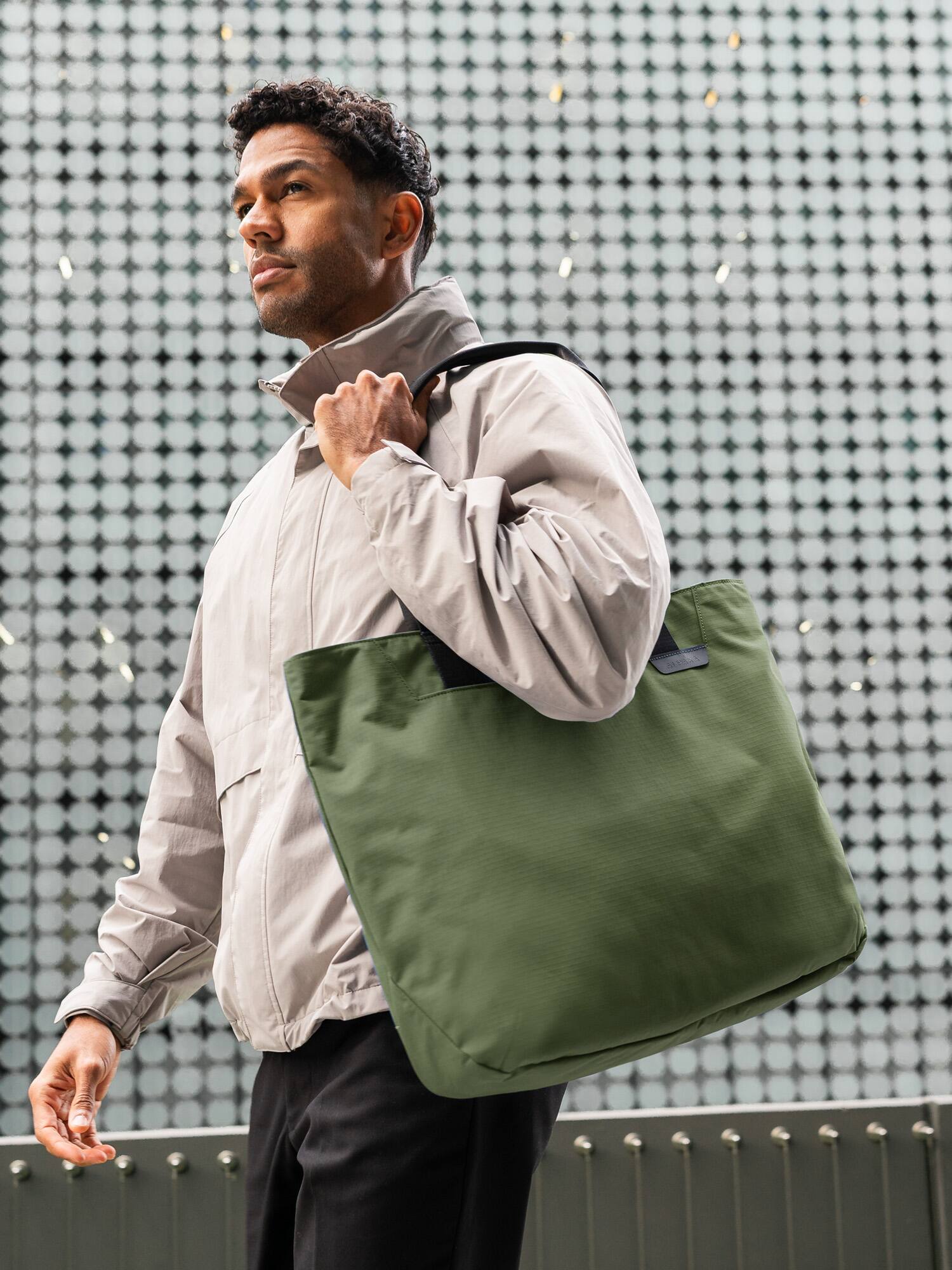 Alt View 2. ALPAKA - Laptop Tote Bag for Work & Travel,20L, Built-in Padded Sleeve for 16" Laptop, Magnetic Open-Top (No Zipper) - Green Axoflux 210D.
