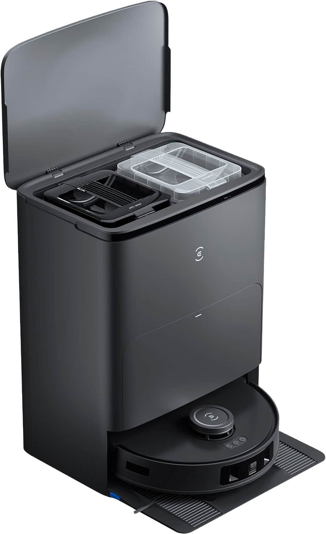 The image shows a black appliance with a clear plastic container on top of it. The container is open, revealing a plastic tray inside. The appliance appears to be a toaster oven or a microwave, and it is sitting on a stand. The plastic tray is likely used for cooking or heating food items in the appliance.