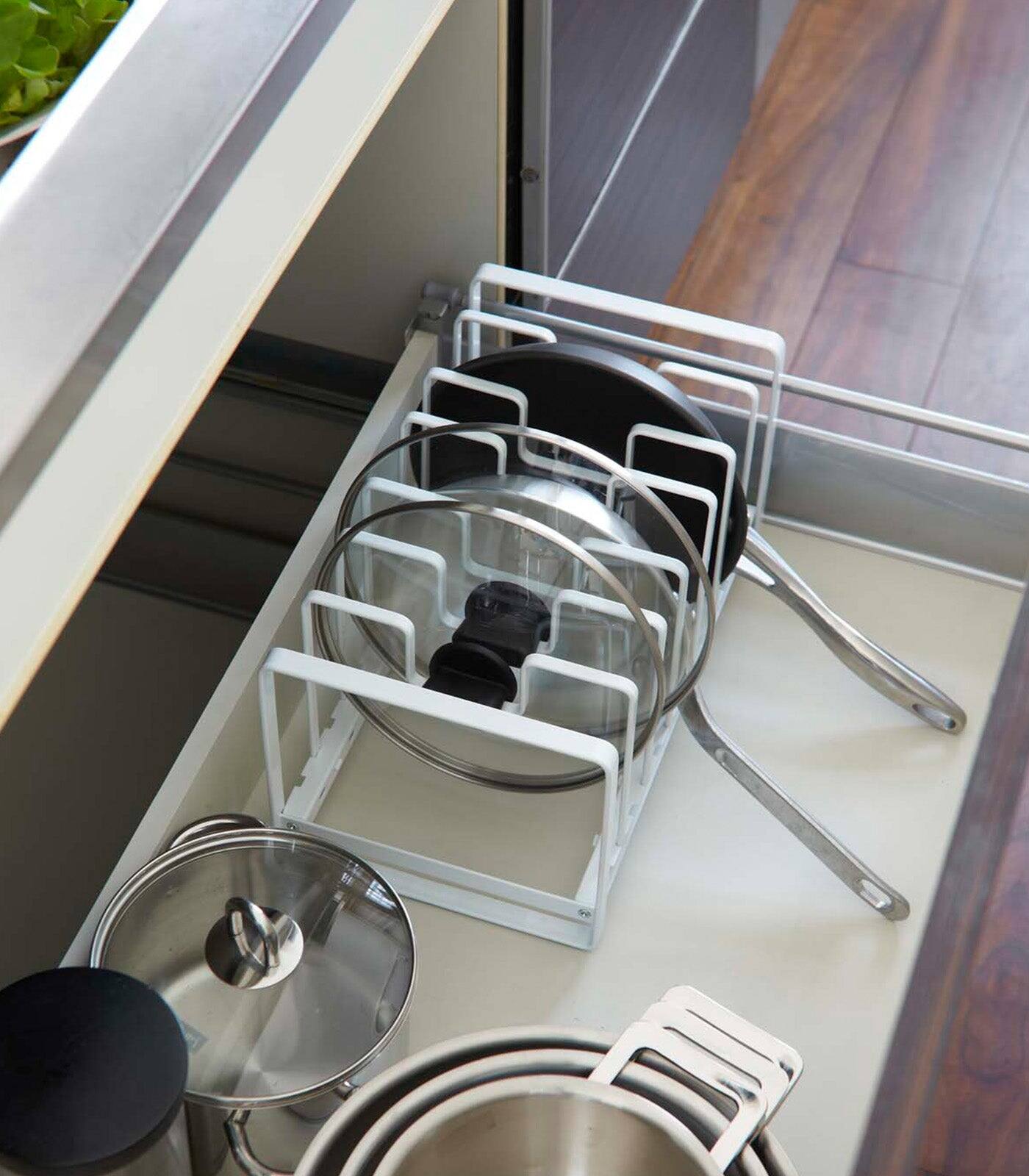 Left. Yamazaki Home - Adjustable Pot Lid and Frying Pan Organizer - Steel - White.