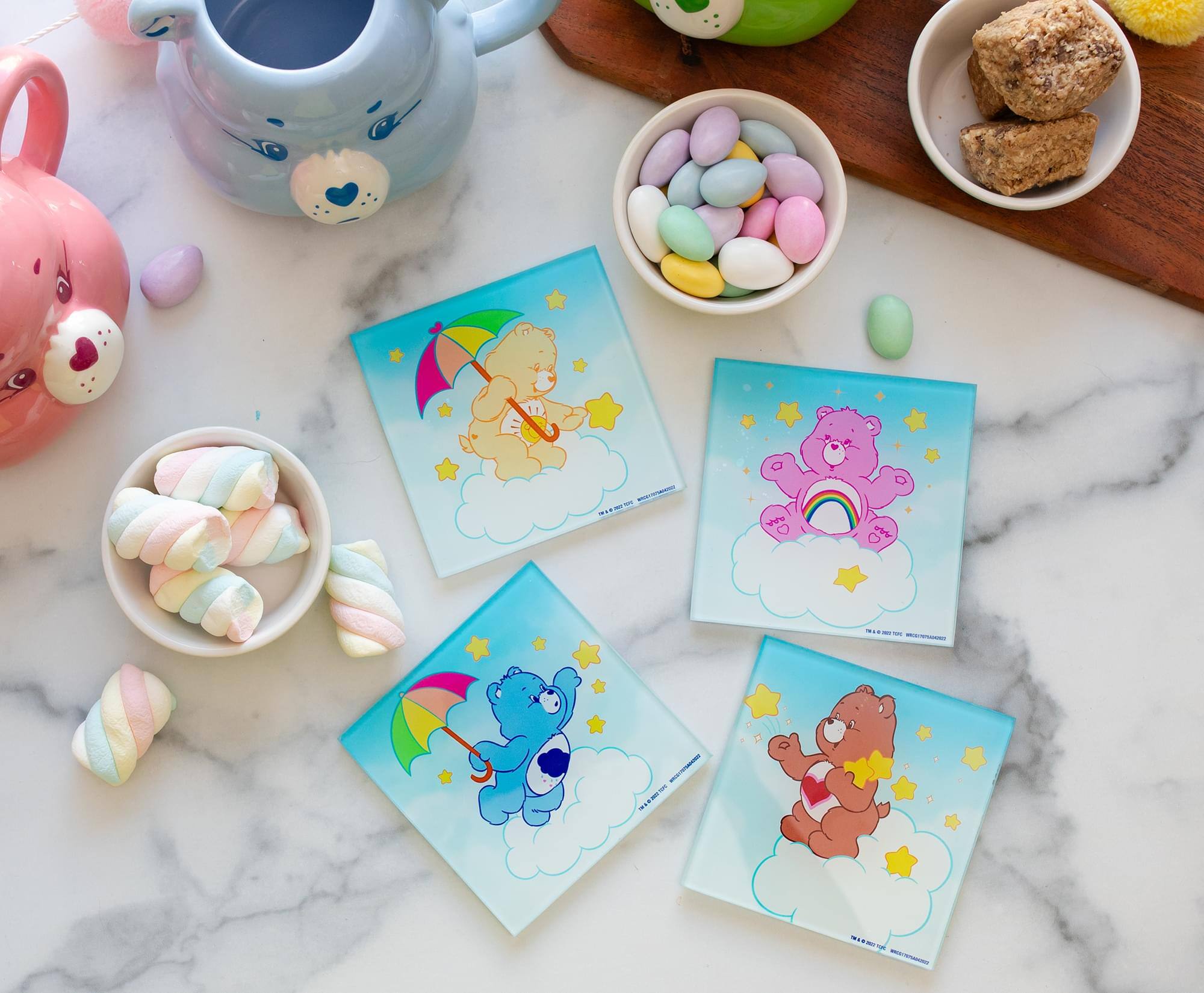 The text on the image is not clearly visible, but it appears to be on the bottom of each card. Here is a corrected and grouped version based on the visible text:

1. "HAPPY BIRTHDAY"
2. "HAPPY BIRTHDAY"
3. "HAPPY BIRTHDAY"
4. "HAPPY BIRTHDAY"

Each card has a similar design with a bear and a rainbow, and the text is likely the same on all cards.