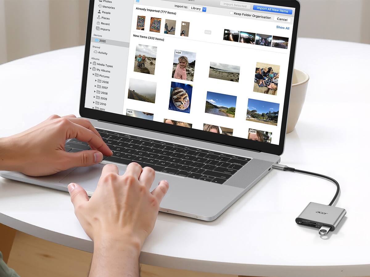 Photos  
Memories  
People  
Places  
Recent  
Imports  
Devices  
2020  
Shared  
Activity  
Albums  
Media Types  
My Albums  
Pictures  
2006  
2007  
2008  
2009  
2010  
2011  
TS  
Import to: Library  
Already imported (777 items)  
New Items (332 items)  
Import All New Items  
Folder Organisation  
Cancel  
Show All  
HDR  
HDR