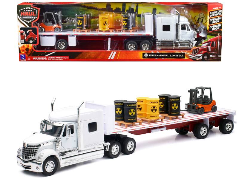 LONG HAUL TRUCKER AUTTION CAUTION STICKN D AGES + 1:32 DIE-CAST WITH PLASTIC OPENABLE DOOR OPENABLE HOOD CAUTION: M to ada a INTERNATIONAL LONESTAR CAUTION CAUTION CAUTION