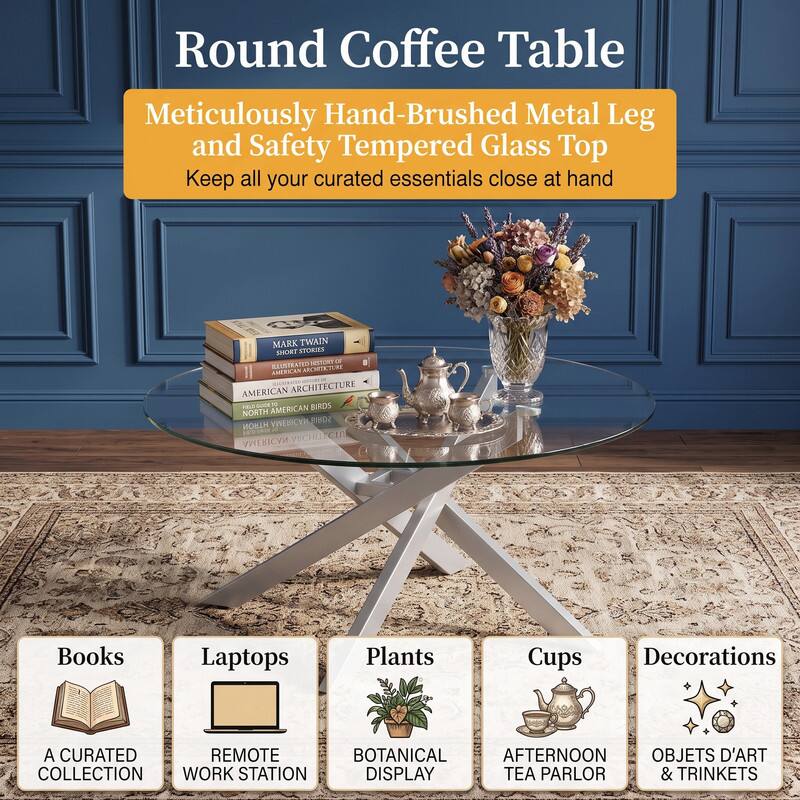Round Coffee Table  
Meticulously Hand-Brushed Metal Leg and Safety Tempered Glass Top  
Keep all your curated essentials close at hand

MARK TWAIN SHORT STORIES  
HISTORY or ILLUSTRATED ARCHITECTURE  
AMERICAN ARCHITECTURE  
10 BIRDS NORTH AMERICAN  
AMERICAN BIROS  
HTRON AMERICAN ARCHITECTU

Books  
Laptops  
Plants  
Cups  
Decorations

A CURATED REMOTE BOTANICAL AFTERNOON OBJETS D'ART COLLECTION WORK STATION DISPLAY TEA PARLOR & TRINKETS