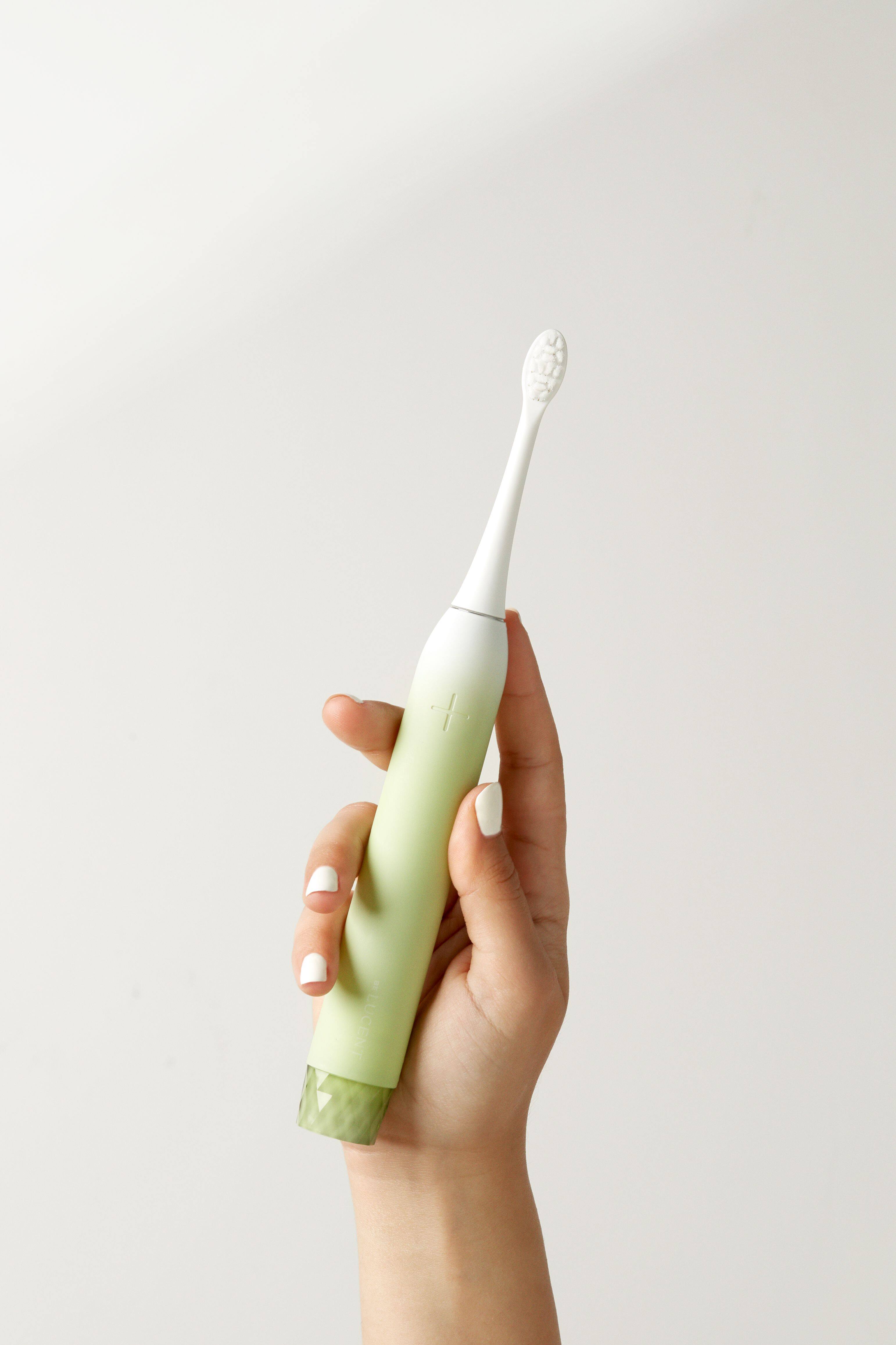 Left. Be Lucent - Sonic Electric Toothbrush that look cosmetically appealing with 3 brush modes.  Last up to 60 days before charging. - Mint.