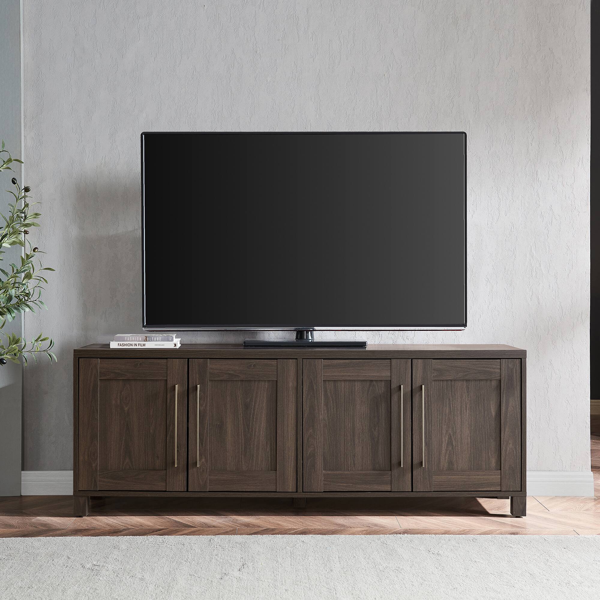 Tv stand with a flat screen tv on top.