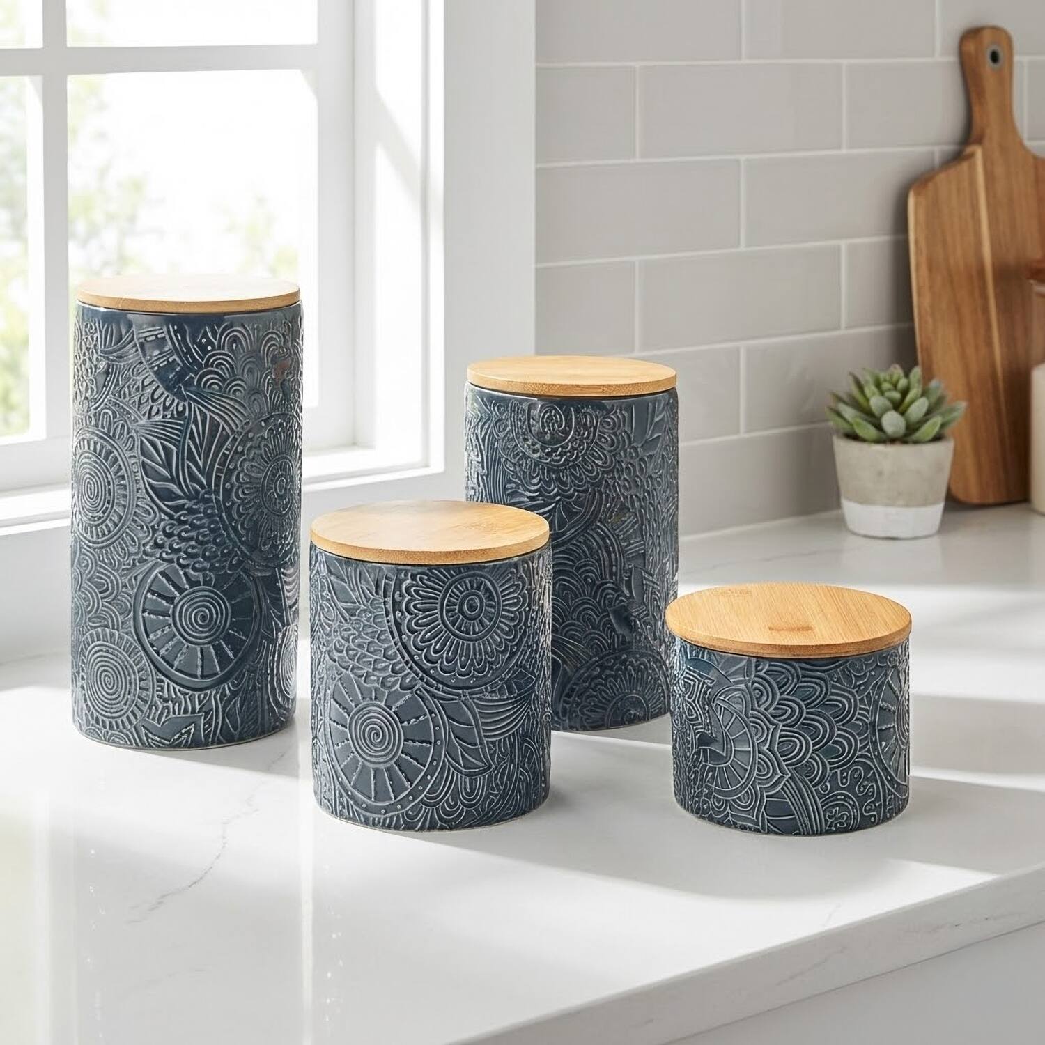 Left. American Atelier - Embossed Blue 4-Piece Kitchen Canister Set.