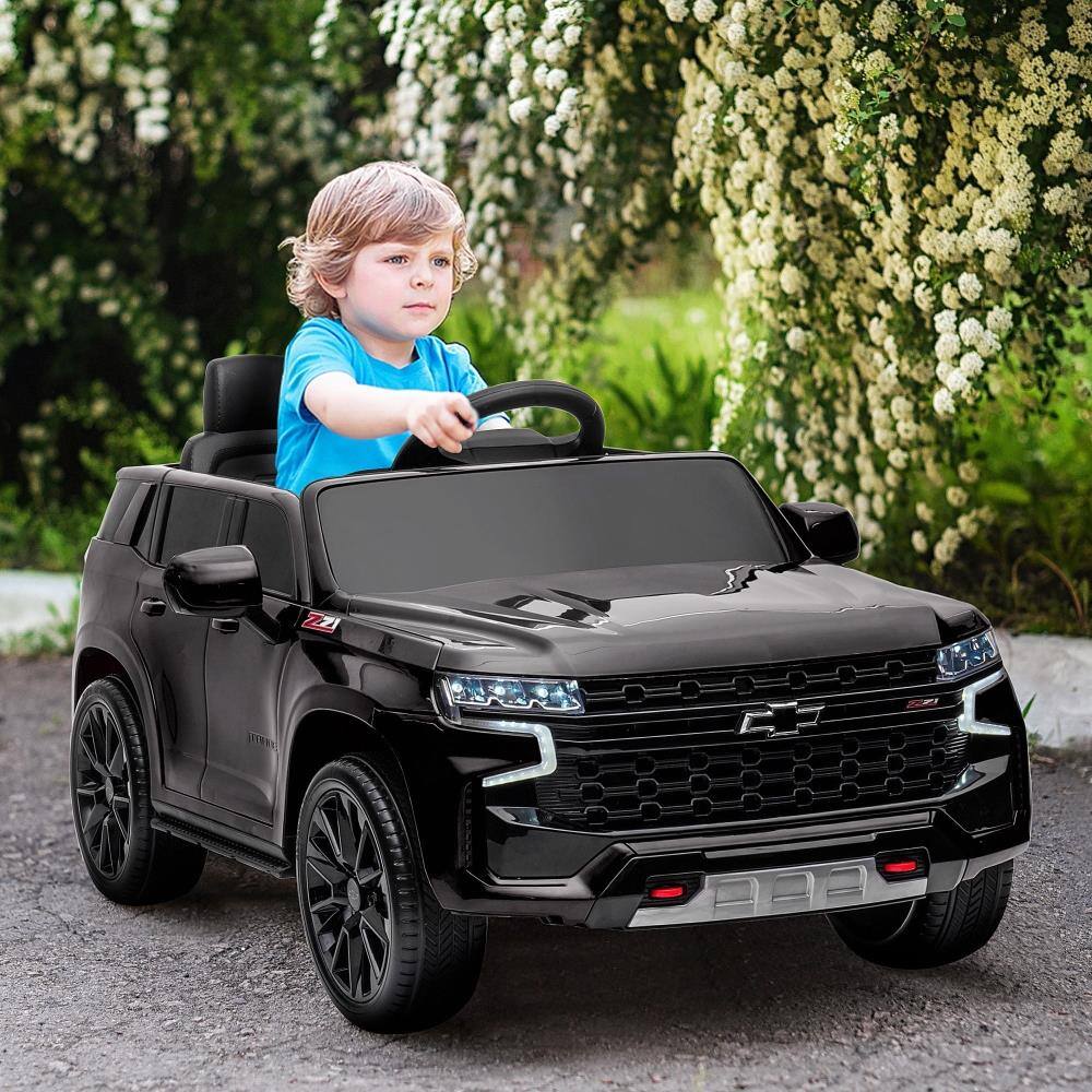 Angle. BreeBe - Aosom Chevrolet TAHOE 12V Licensed Kids ride on Car with Remote, Music, Lights, Horn, Suspension, Electric, Ages 3-6 - Black.