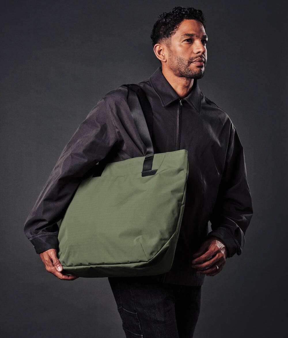 Left. ALPAKA - Elements Tote 20L Laptop Tote Bag with Padded 16" Sleeve,Open Top with Magnetic Closure - Green Axoflux 210D.