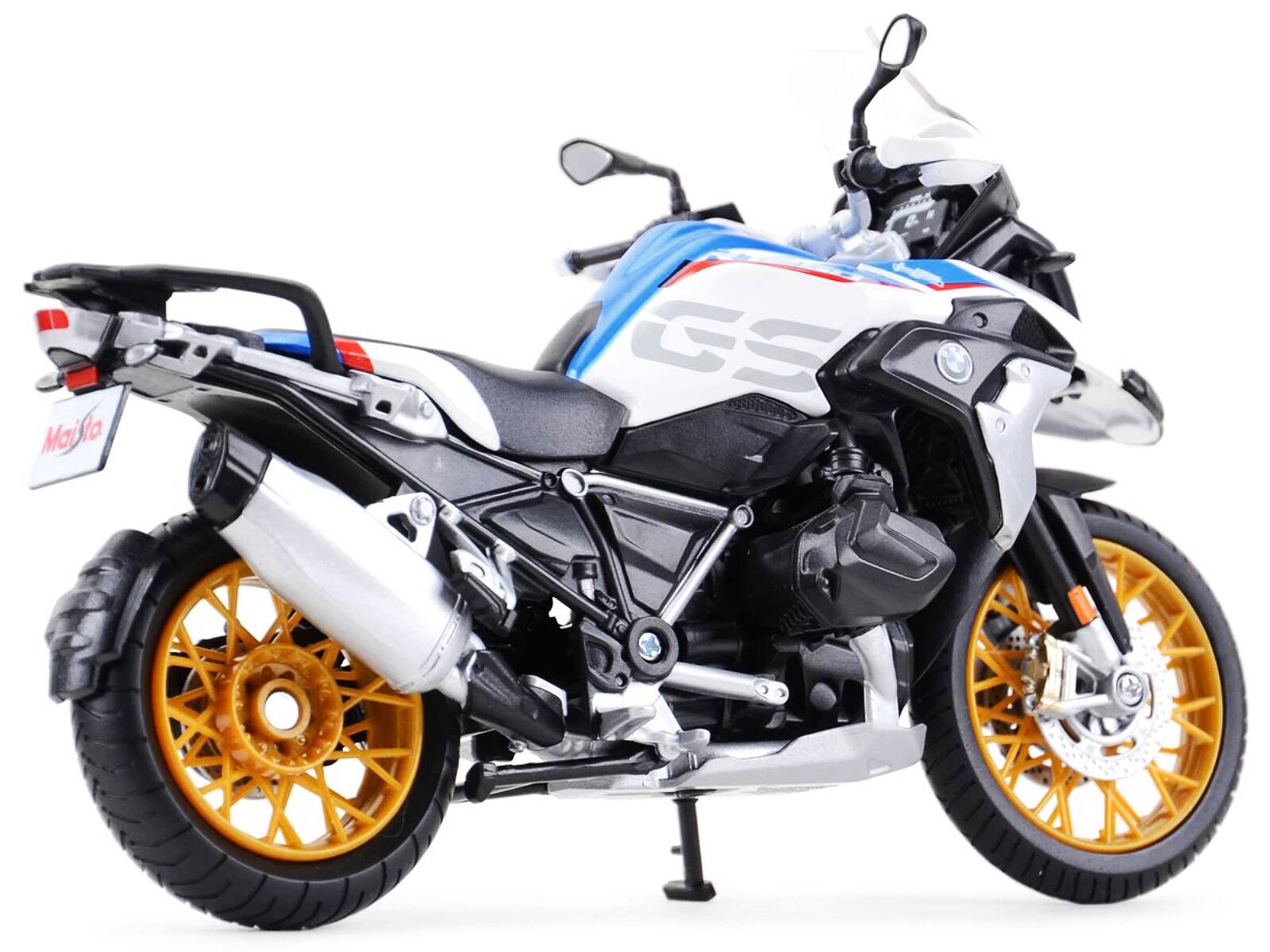 Left. Maisto - BMW R1250 GS White with Blue and Red Stripes 1/12 Diecast Motorcycle Model by Maisto - White with Blue and Red.