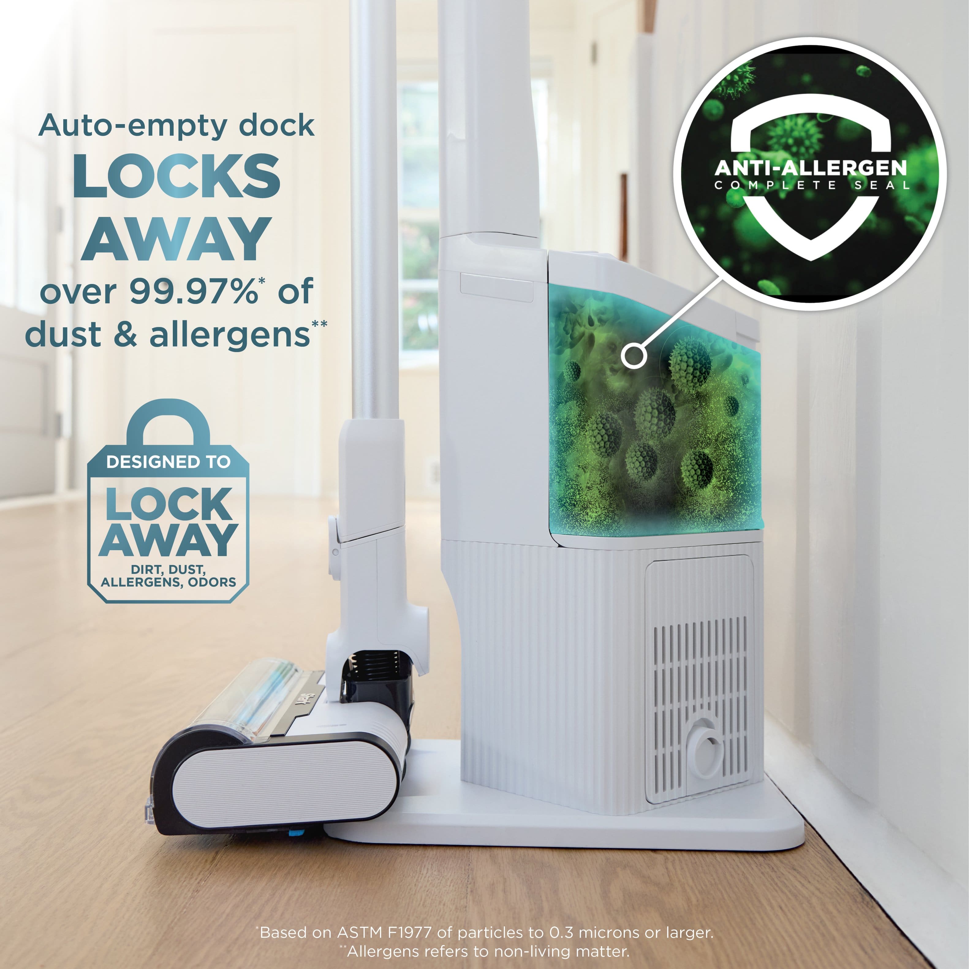 The text on the image reads: "Auto-empty dock LOCKS AWAY over 99.97%* of dust & allergens" ANTI-ALLERGEN C COMPLETE SEAL DESIGNED TO LOCK AWAY DIRT, DUST, ALLERGENS, ODORS Based on ASTM F1977 of particles to 0.3 microns or larger. "Allergens refers to non-living matter."