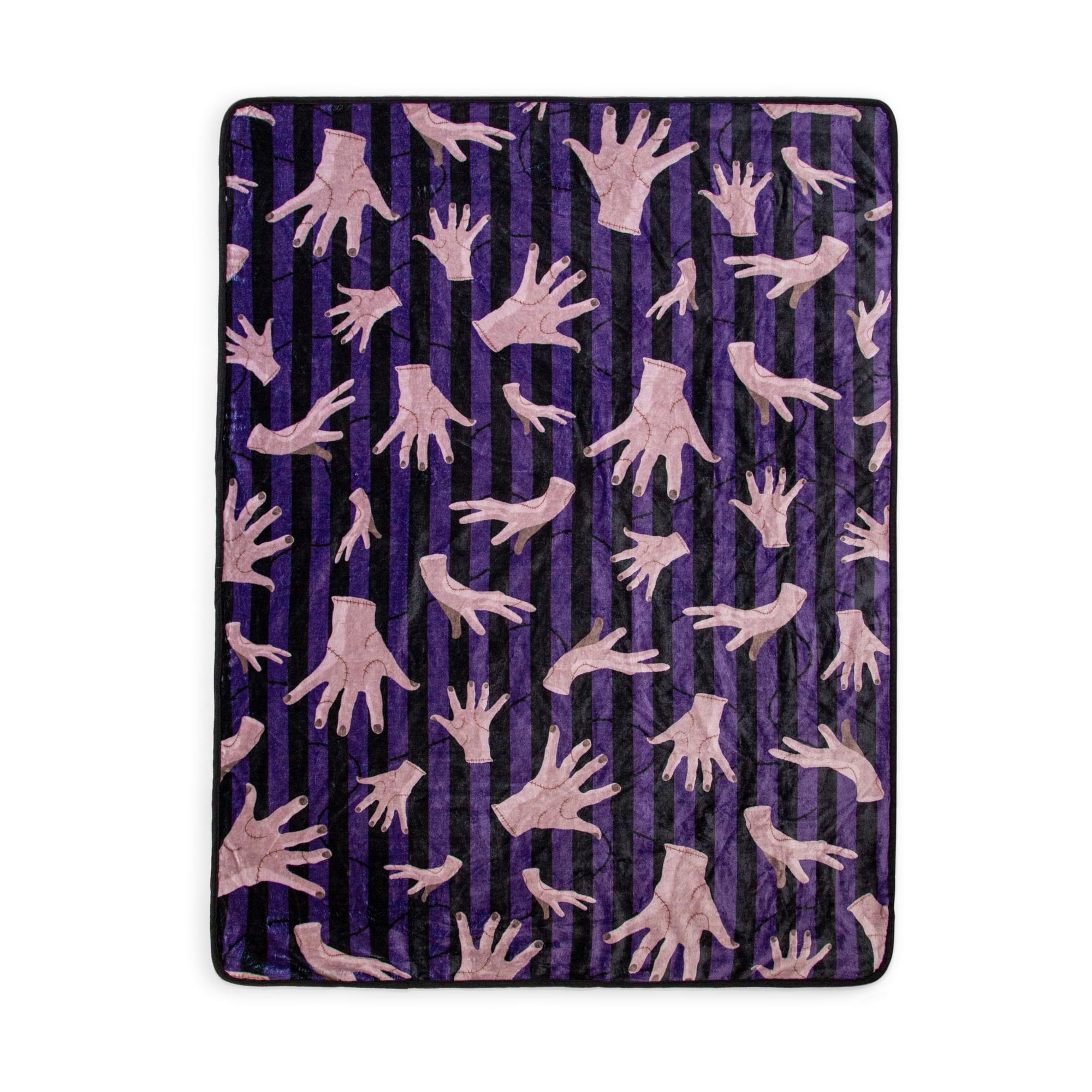 Front. Silver Buffalo - Addams Family Wednesday Thing Raschel Throw Blanket | 45 x 60 Inches - Purple.