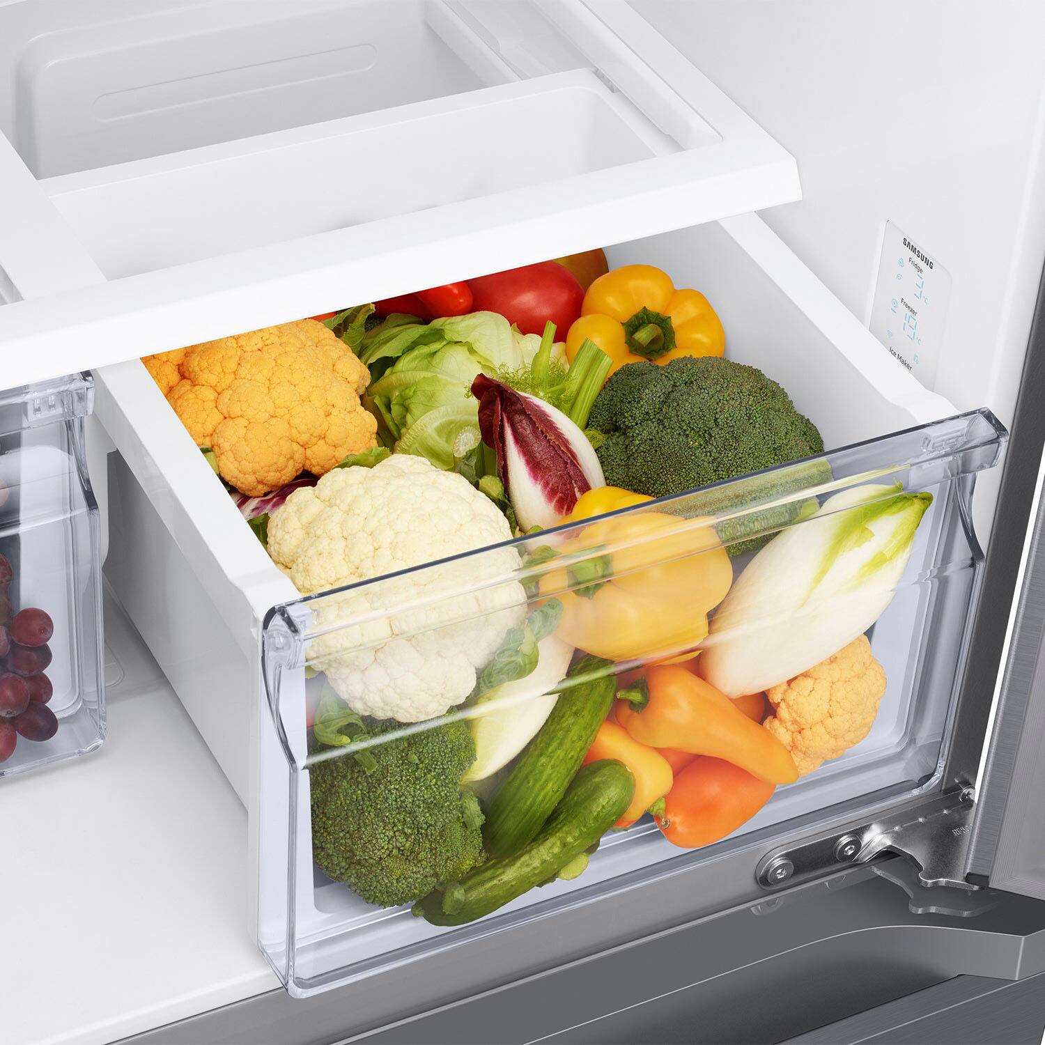 I'm sorry, but I cannot group or correct the text "SAMSONS hp 1Os U -" as it does not seem to be related to the image of the refrigerator with various vegetables. The image shows a refrigerator with a drawer full of vegetables, including broccoli, carrots, and peppers.