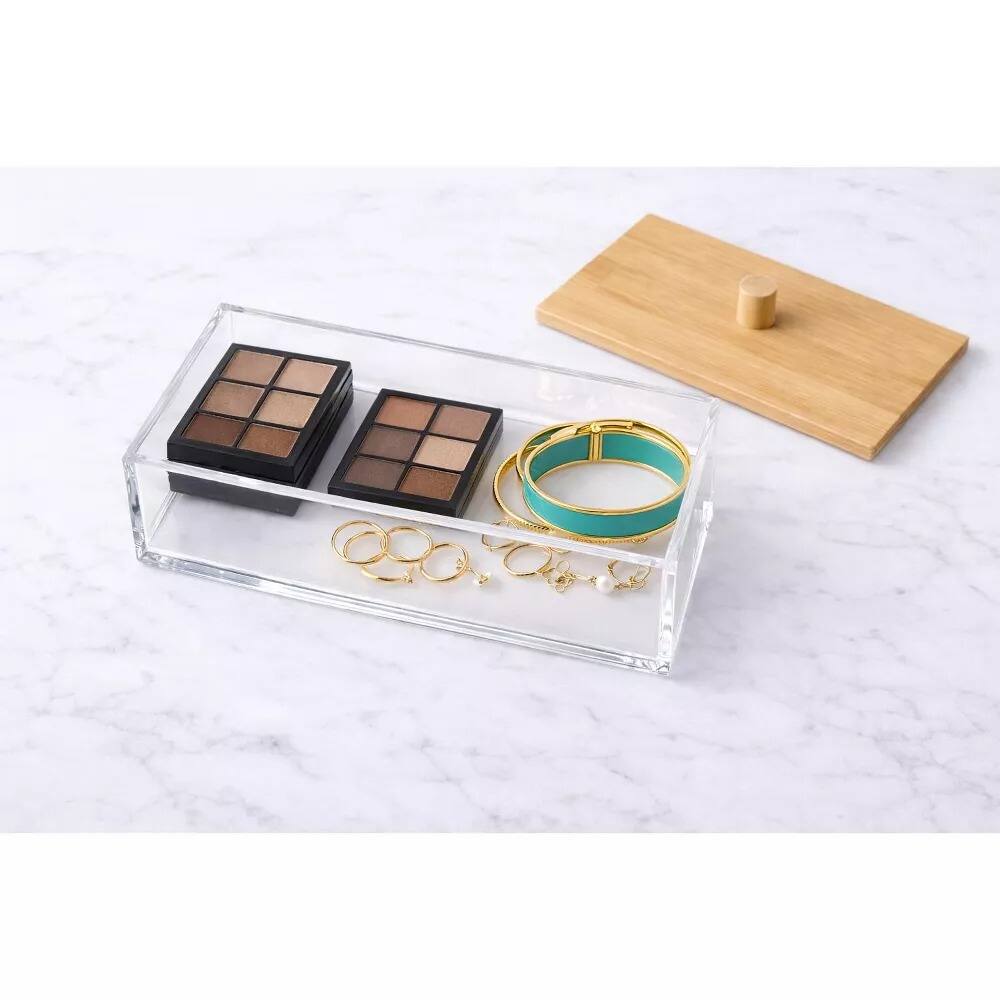 Left. Elle - Acrylic Makeup Organizer with Bamboo Lid, Clear Nonslip Rectangular Cosmetic Storage Box for Bathroom & Vanity - Clear/Natural Bamboo.