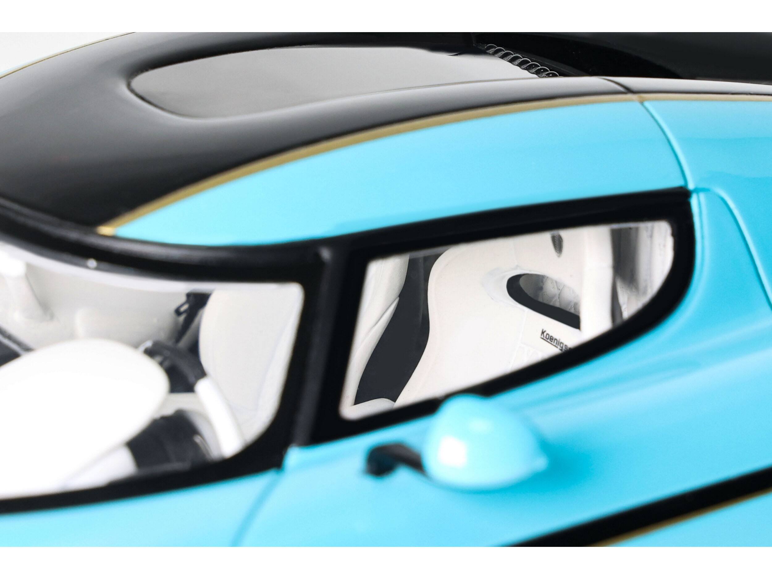 Left. GT Spirit - 2018 Koenigsegg Regera Baby Blue with Black Stripes and White Interior 1/18 Model Car by GT Spirit - Blue ,Black , White.