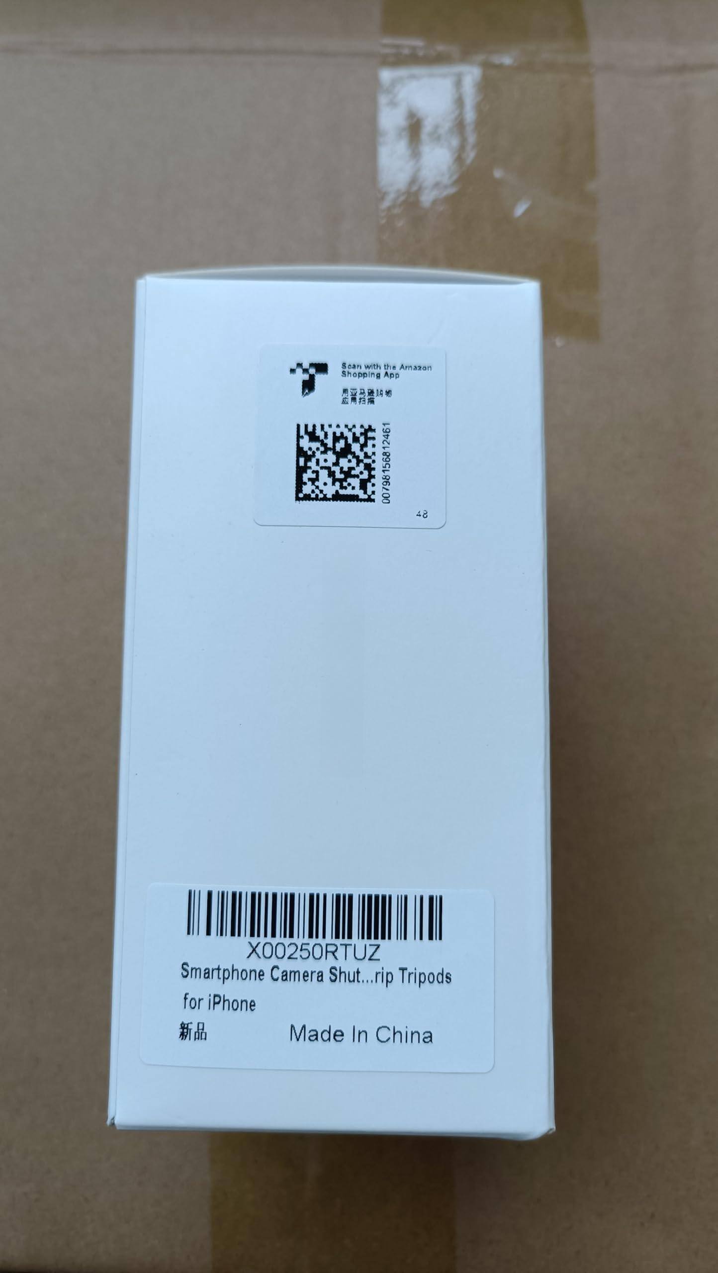 Sure, here is the corrected and grouped text from the image:

---

**Sean 8 with te Amazon Shopping App**

**X00250RTUZ**

**Smartphone Camera Shut...rip Tripods for iPhone**

**Made In China**

**X00250RTUZ**

**Smartphone Camera Shut...rip Tripods**

**for iPhone**

**新品**

**Made In China**

---

This text includes the product code, description, and manufacturing information.