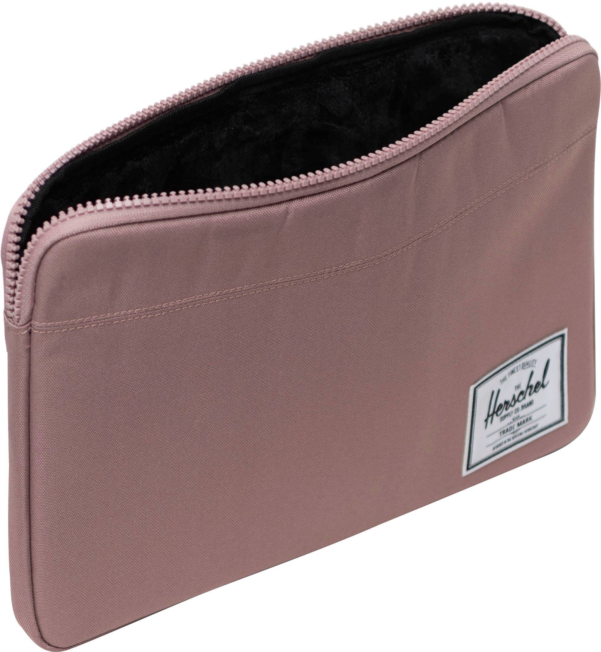 The text on the image reads "Herschel Supply Co." which is a company that specializes in producing bags, wallets, and other accessories.