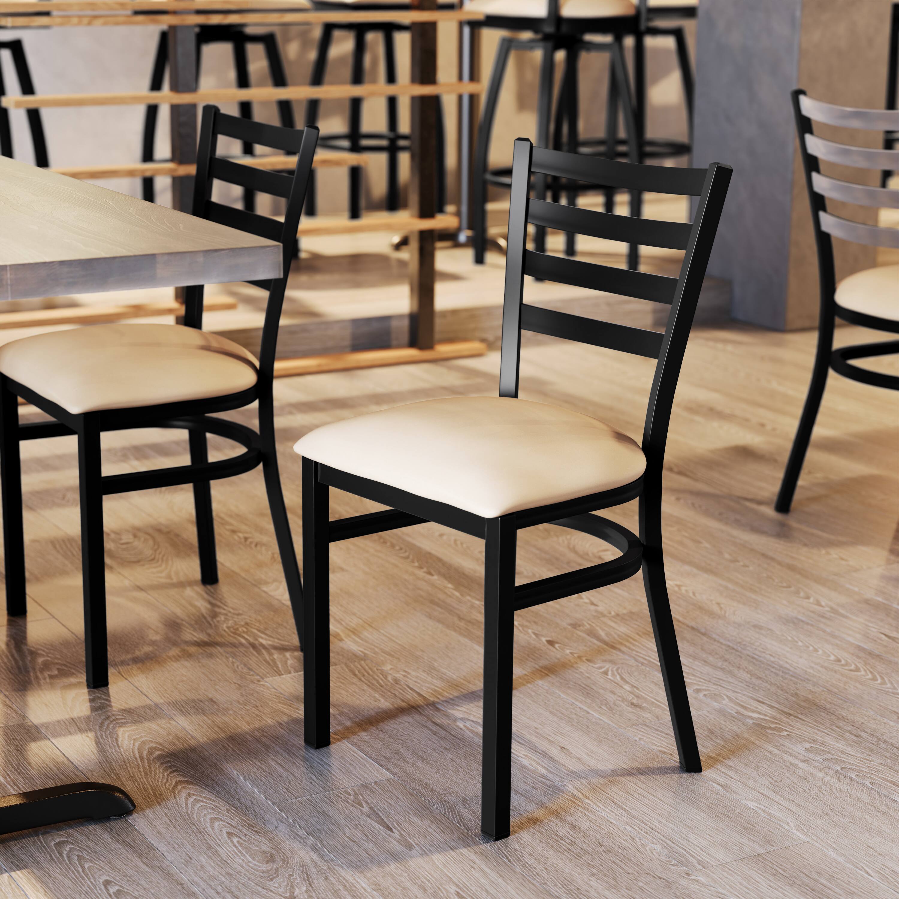 Alt View 5. Emma + Oliver - 4 Pack Ladder Back Metal Restaurant Chair - Upholstered Seat - Tan Vinyl Seat/Black Metal Frame.