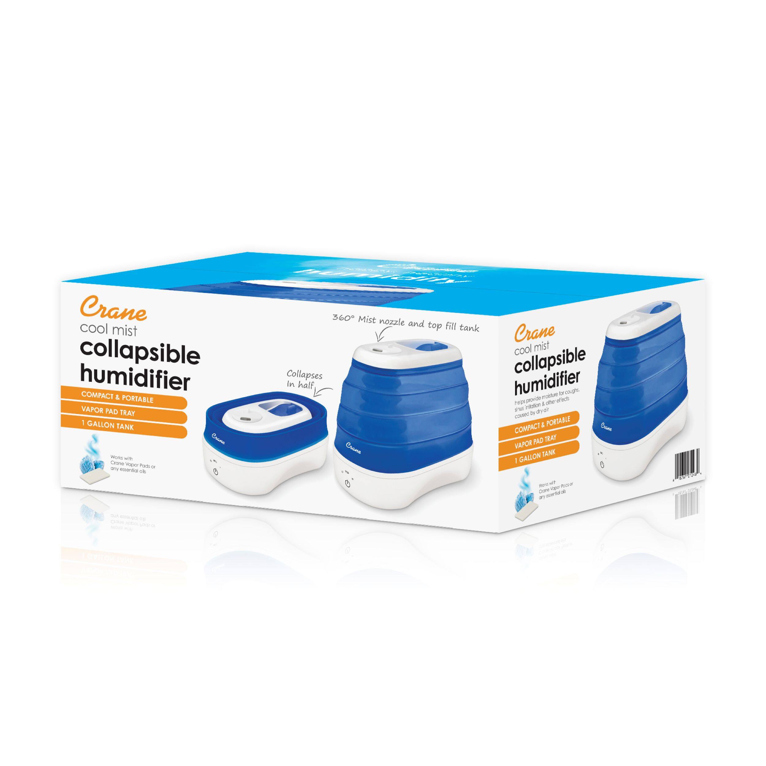 The image features a blue and white collapsible humidifier from Crane. The humidifier is compact and portable, making it a convenient choice for those who want a misting device that can easily fit into their daily routine. The humidifier has a 1-gallon tank and a 360-degree mist nozzle, providing a wide range of coverage for the user. The humidifier collapses in half, making it easy to store and transport. The box containing the humidifier is white and blue, with the Crane brand name prominently displayed on it.