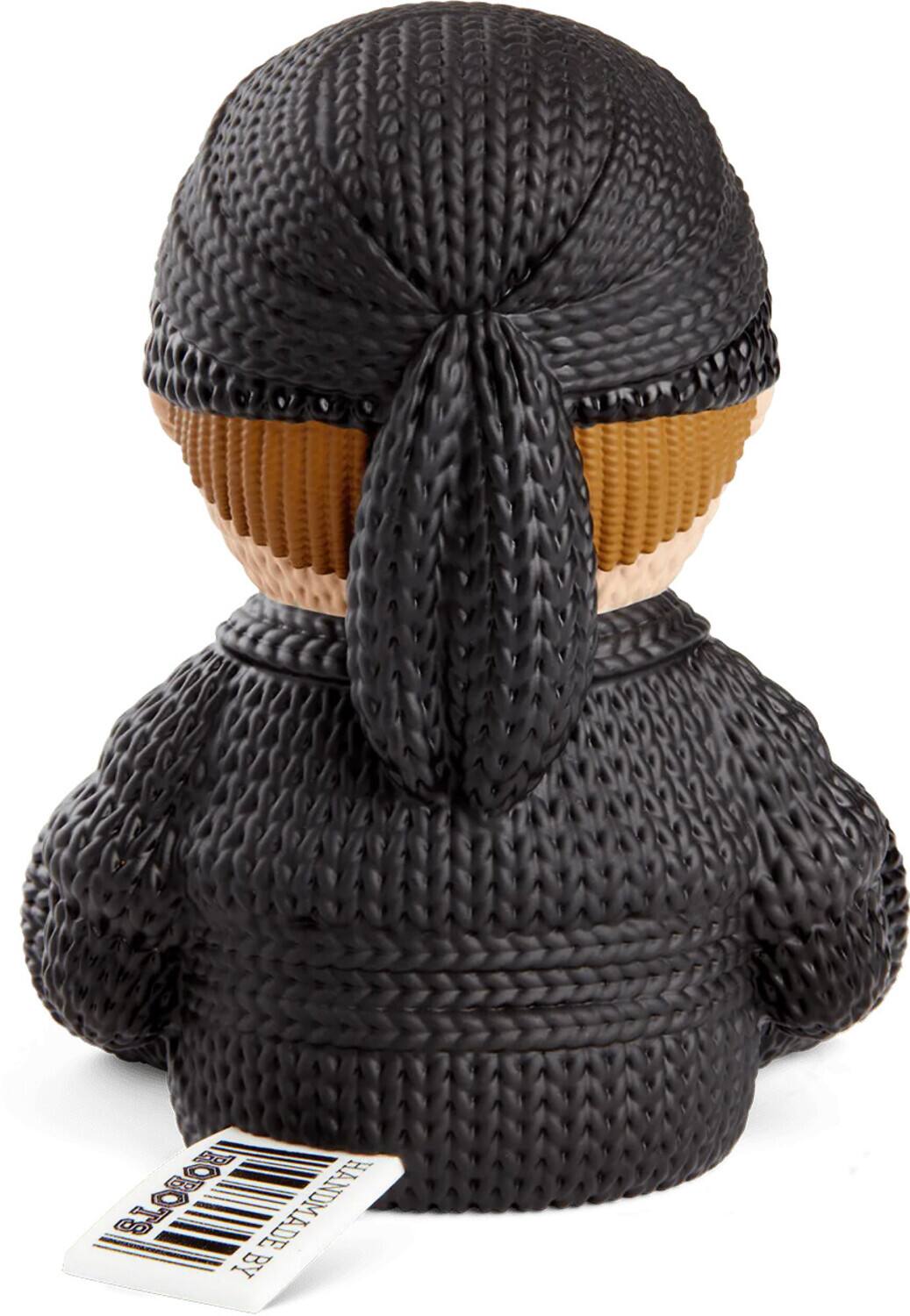 The text on the image is "SLO8OI HANDMADE BY". It appears to be a label or tag attached to the item.