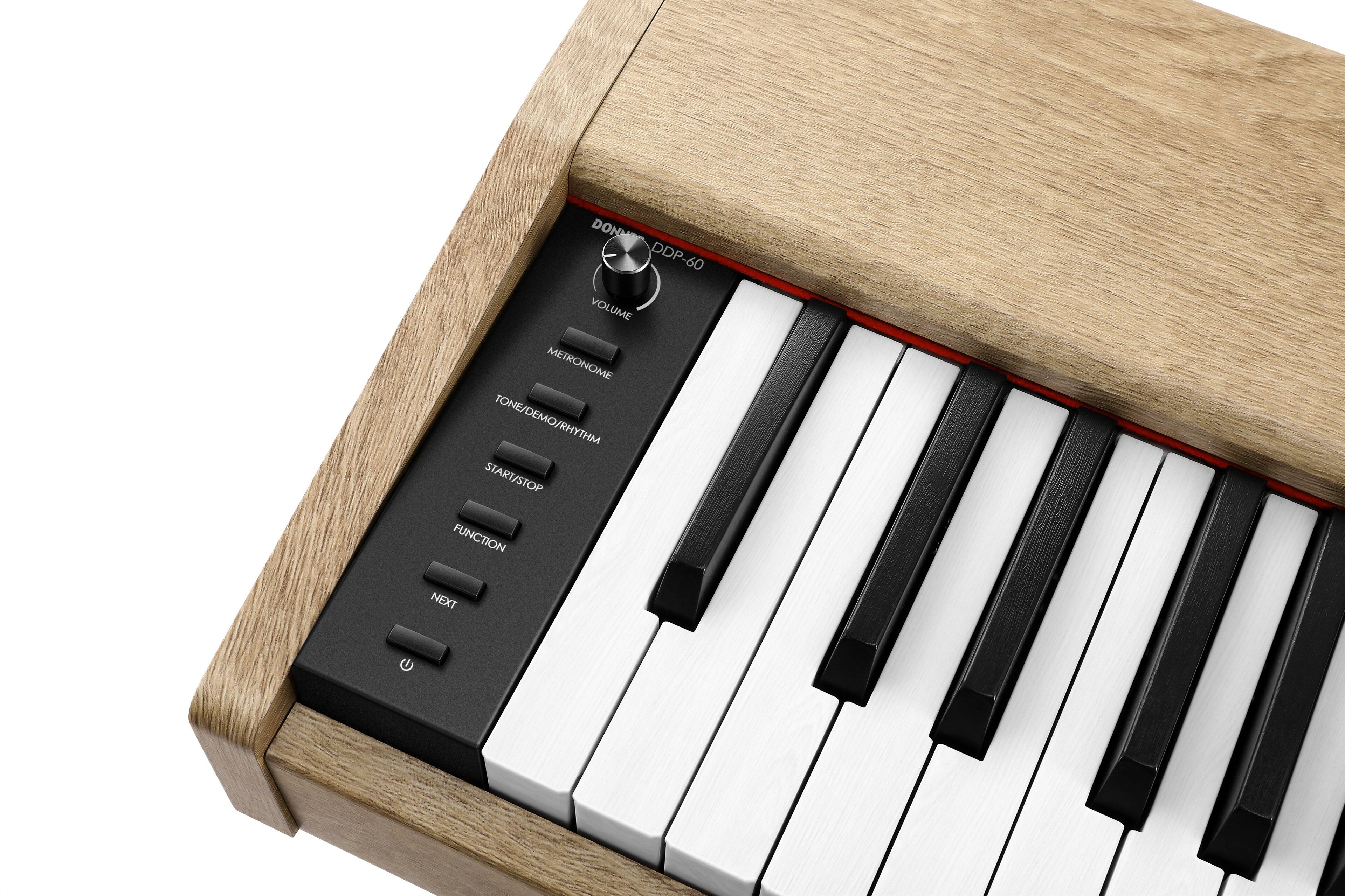 The text on the image is: "DONN DDP 60 VOLUME METRONOME TONE/DEMO/RHYTHM START/STOP FUNCTION NEXT."