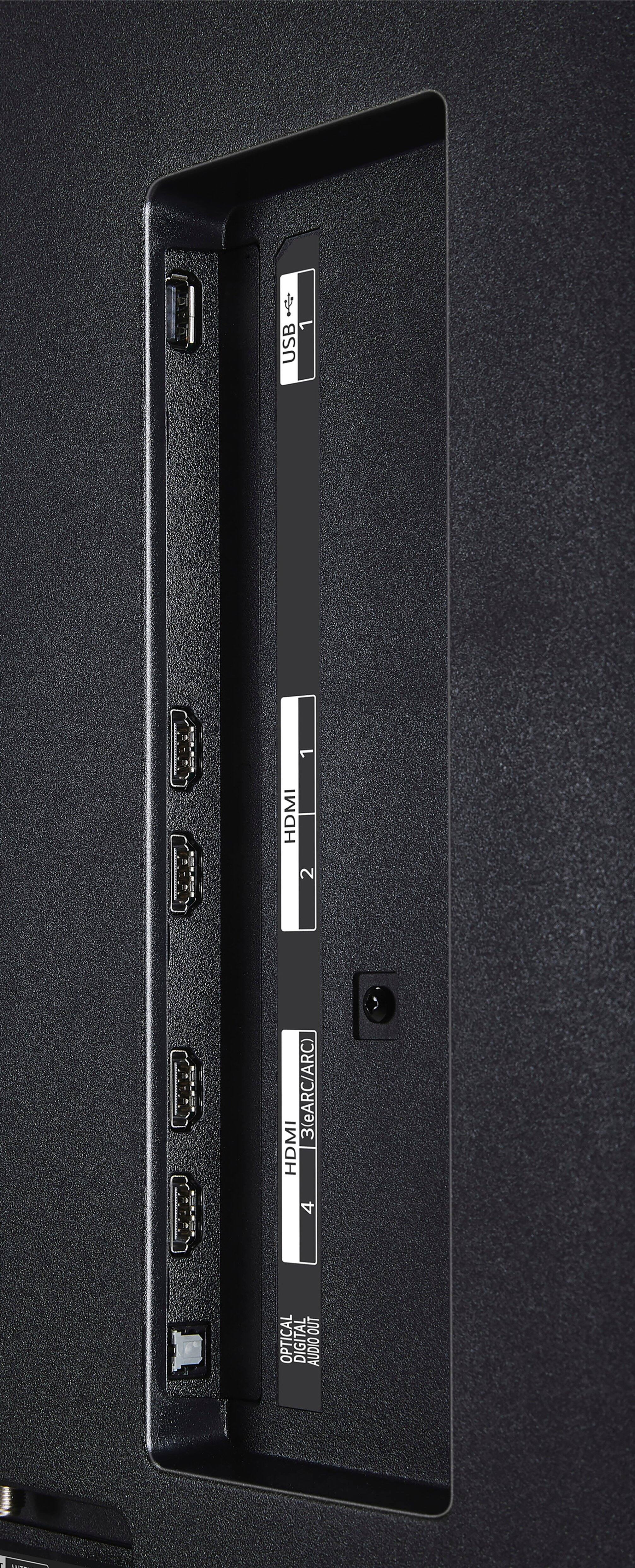 The text on the image reads: "USB PERC 1 HDMI 2 3 (eARC/ARC) HDMI 4 OUT OPTICAL DIGITAL AUDIO OUT 1 -". The text is grouped and corrected as follows:

1. USB PERC 1 HDMI 2 3 (eARC/ARC) HDMI 4 OUT OPTICAL DIGITAL AUDIO OUT 1 -

This text describes the ports and features available on the back of the device. The device has a USB port, four HDMI ports, and an optical digital audio output. The presence of the eARC/ARC feature suggests that the device supports high-resolution audio and video streaming.