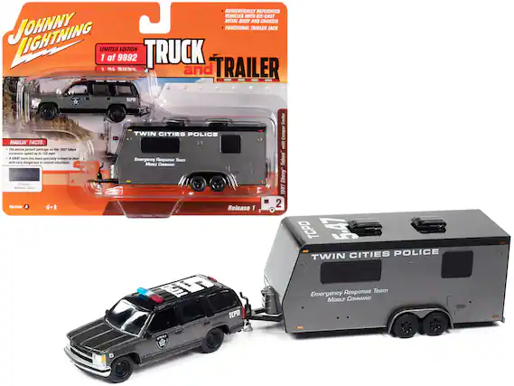 **Johnny Lightning**
**Limited Edition**
1 of 9892
**Truck and Trailer**
**Authentically Replicated Vehicles with Die-Cast Metal Body and Chassis**
**Functional Trailer Jack**
**Haulin' Facts:**
- The police pursuit package on the 1987 Tahoe increases speed up to 130 mph.
- A SWAT team has been specially trained to deal with very dangerous or violent situations.
**Custom Metallic Gray Version A**
**6+**
**Release 1**
**Twin Cities Police**
**Emergency Response Team**
**Mobile Command**
**Twin Cities Police**
**Emergency Response Team**
**Mobile Command**