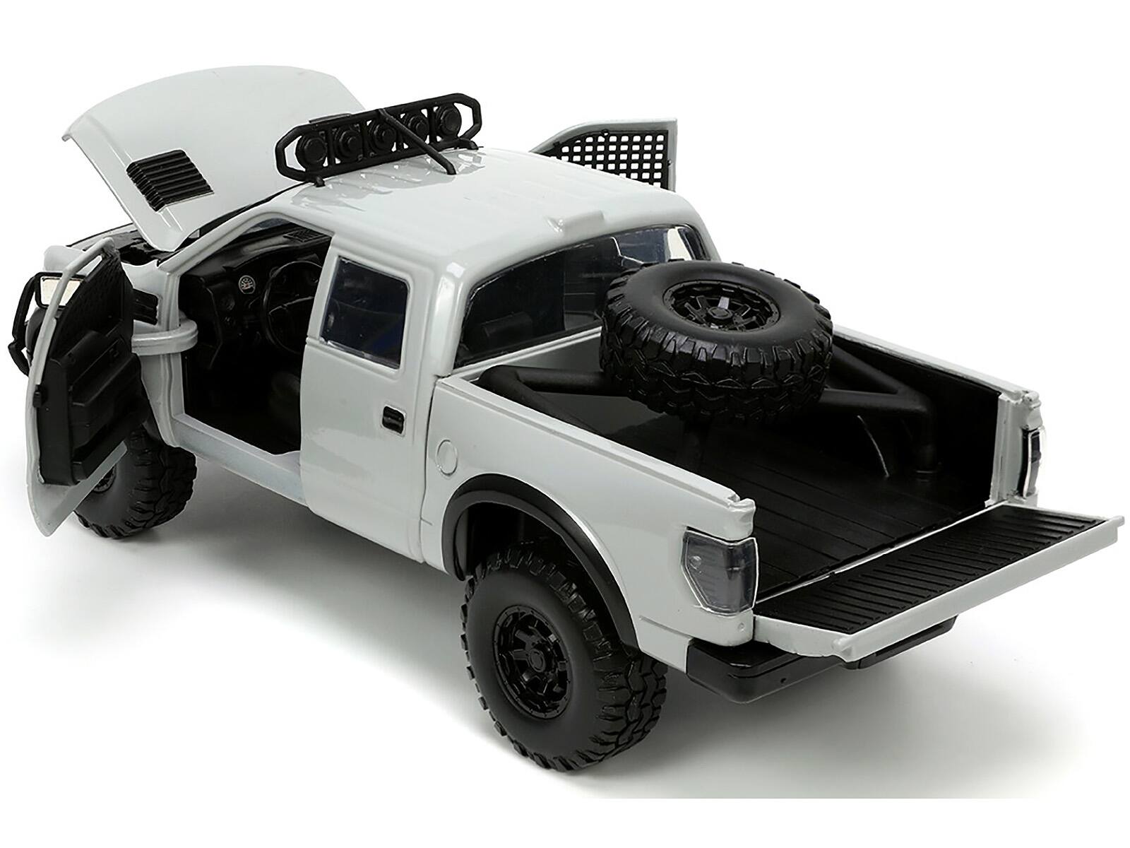 Left. Jada - 2011 Ford F-150 SVT Raptor Pickup Truck Light Gray with Extra Wheels "Just Trucks" Series 1/24 Diecast Model Car by Jada - Light Gray.