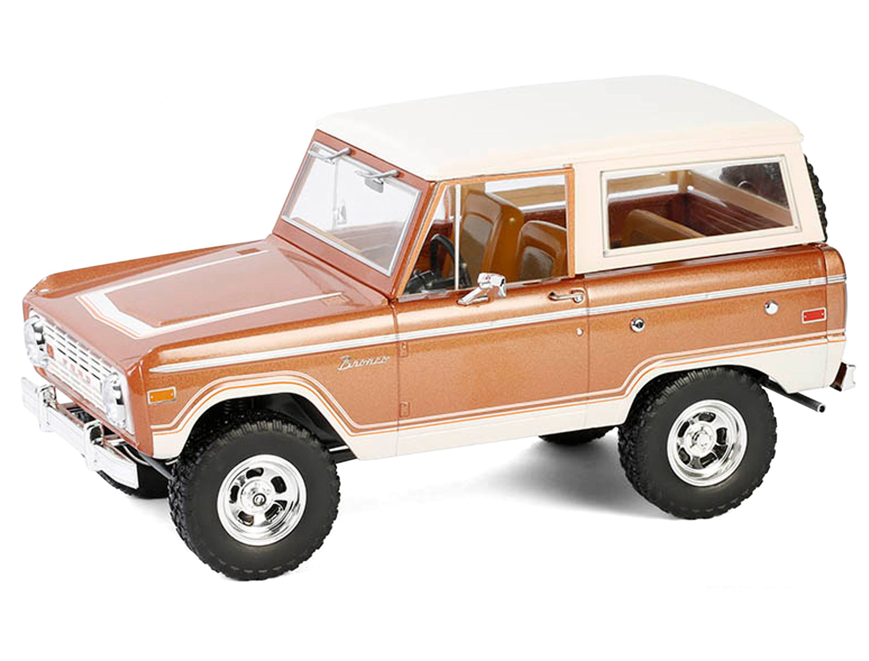 Angle. Greenlight - 1973 Ford Bronco Hot Ginger Metallic with Cream Top "Artisan Collection" 1/18 Diecast Model Car by Greenlight - Ginger Metallic with Cream Top.