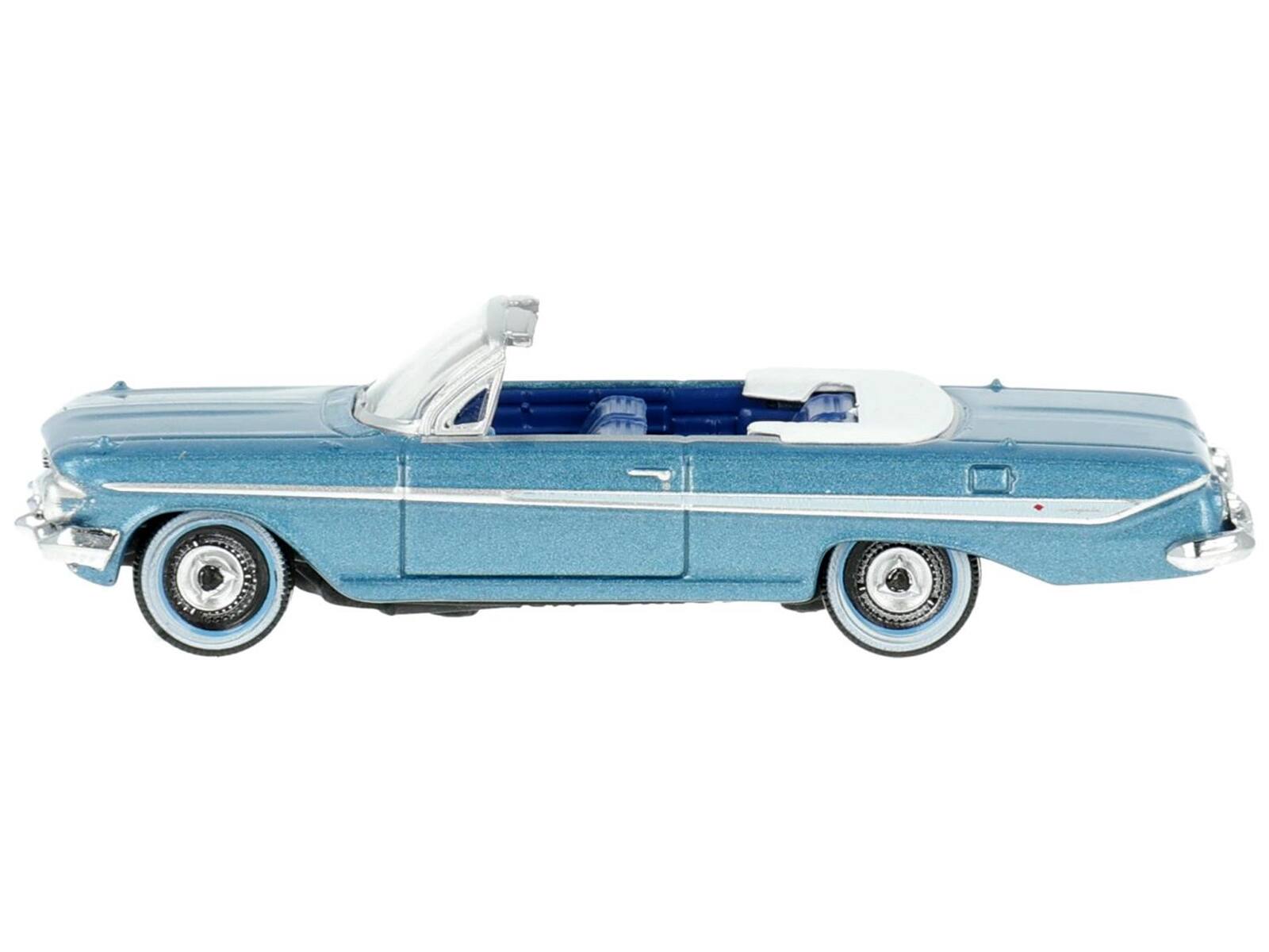 Angle. Oxford Diecast - 1961 Chevrolet Impala Convertible Jewel Blue Metallic and White with Blue Interior 1/87 (HO) Scale Diecast Model Car - Blue Metallic and White with Blue.