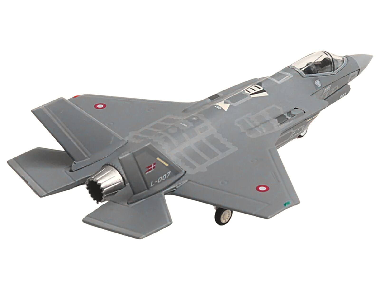 Left. Herpa - Lockheed Martin F-35A Lightning II Eskadrille 727 Skrydstrup L-007 Royal Danish Air Force Herpa 1/200 Diecast Model - Multi.