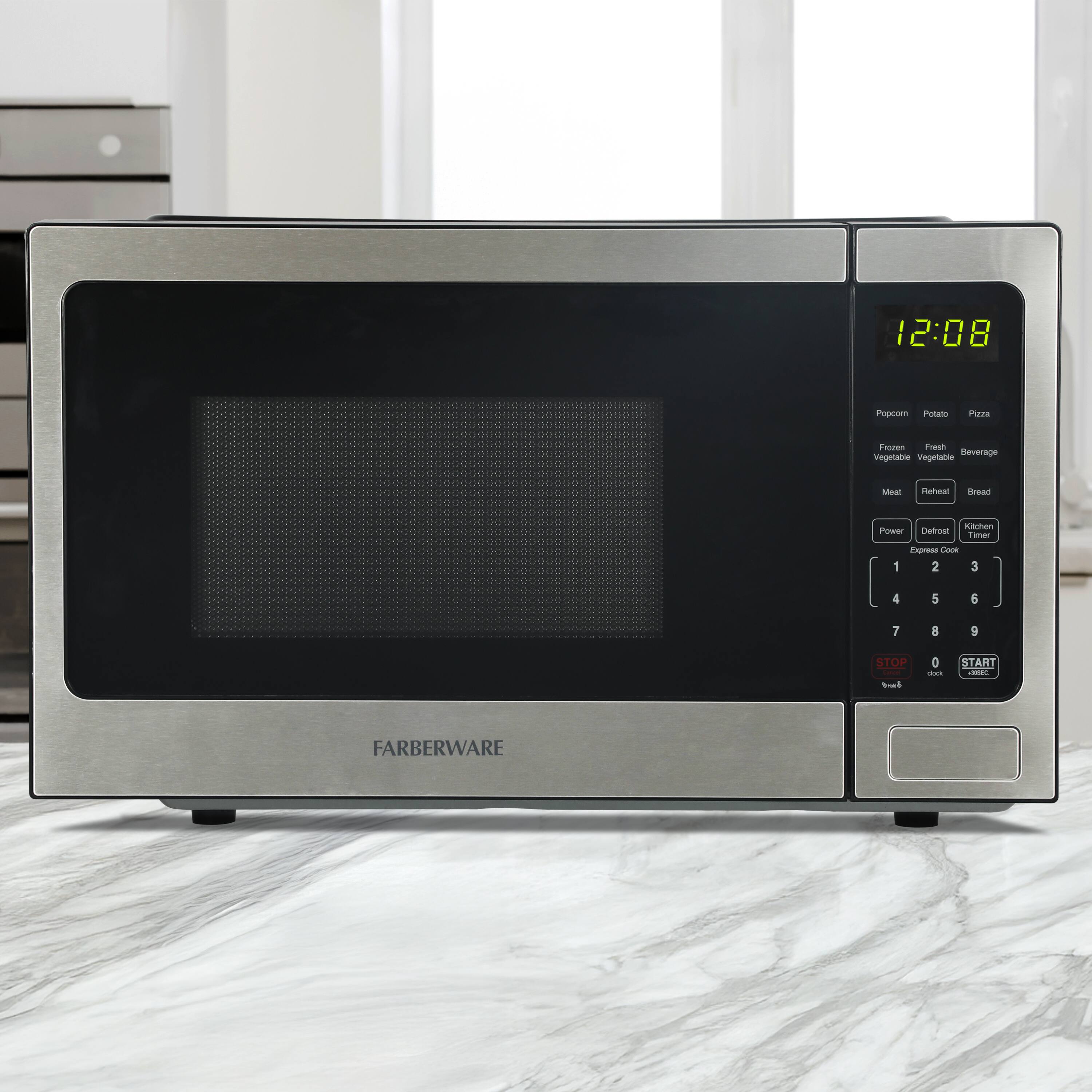 12:08  
Popcorn Potato Pizza  
Frozen Fresh Beverage  
Vegetable Vegetable  
Meat Reheat Bread  
Power Defrost Kitchen Timer  
Express Cook  
1 2 3  
4 5 6  
7 8 9  
0  
STOP START  
FARBERWARE