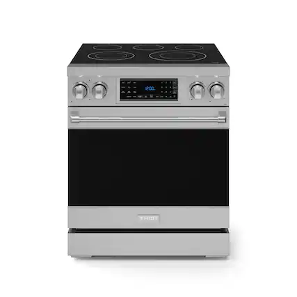The image shows a stainless steel Thor oven with a digital display. The oven has a stove top and a built-in clock. The clock is set to 12:00, indicating that it is currently noon. The oven is a modern and sleek appliance, likely designed for efficient cooking and easy use.