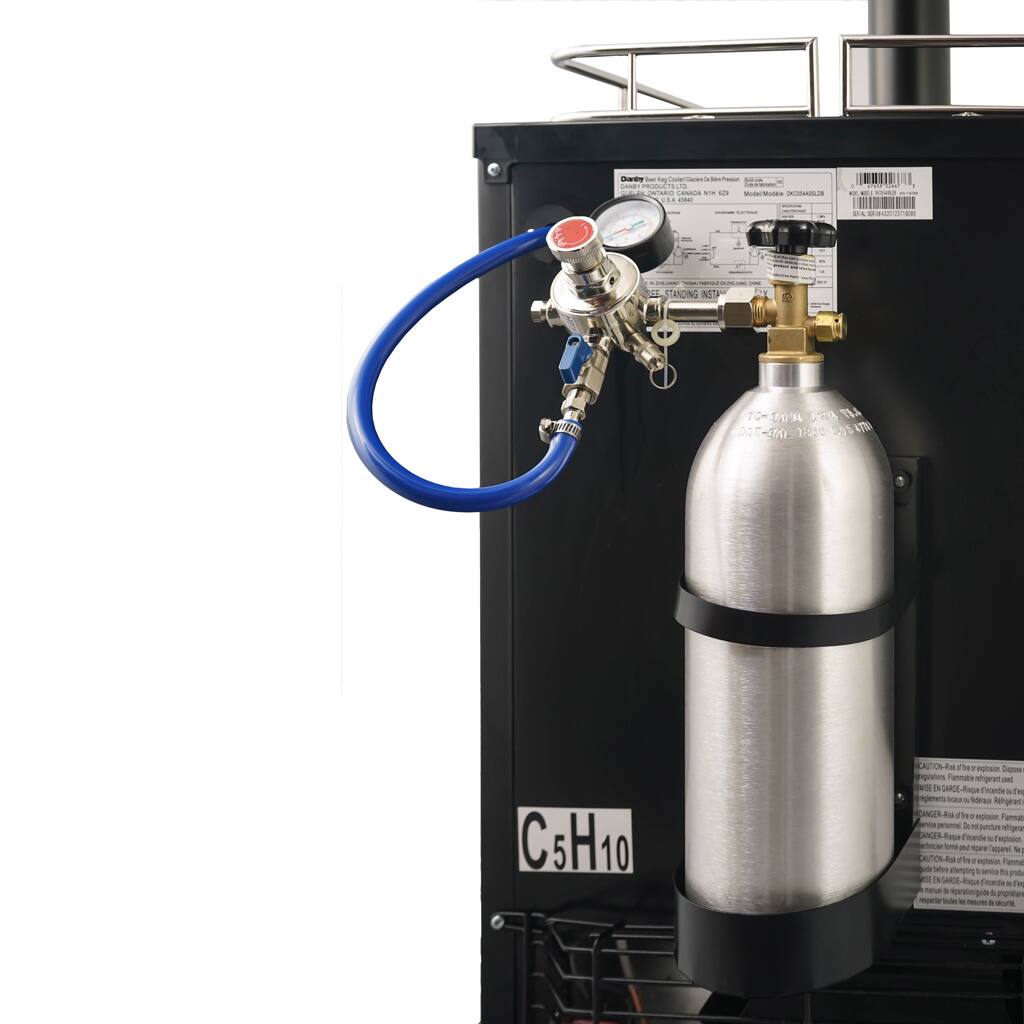 The image features a piece of equipment with a silver tank and a blue hose attached to it. The tank is labeled "C5H10," and there is a red button on the side of the tank. The equipment is likely used for a specific purpose, but the exact function cannot be determined from the image alone.