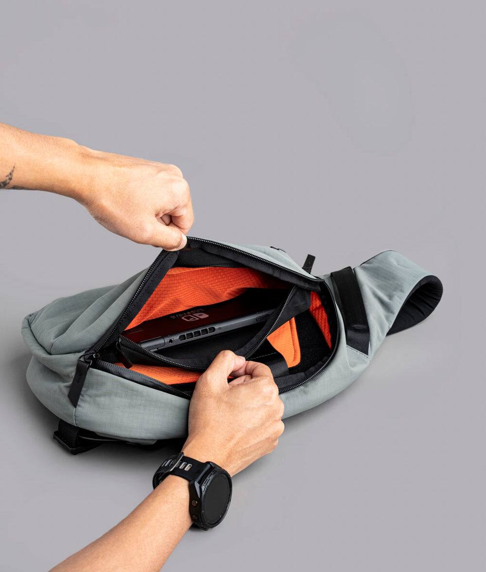 Alt View 7. ALPAKA - Crossbody Sling Bag 7.5L (Left Shoulder) for Men, Fits 11" Tablet, Phone Sleeve, Bottle Pocket, Luggage Pass-Through - Grey Axoflux 210D.