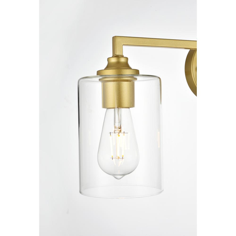 Left. Living District - Mayson 3 light Brass and Clear Bath Sconce - Brass And Clear.