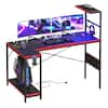 Front. RSPGAME - 57.4'' Gaming Desk with Power Outlet LED Lights Reversible Computer Desk with Shelf Holder & Hook, Gaming Table for Home - Black & Red.